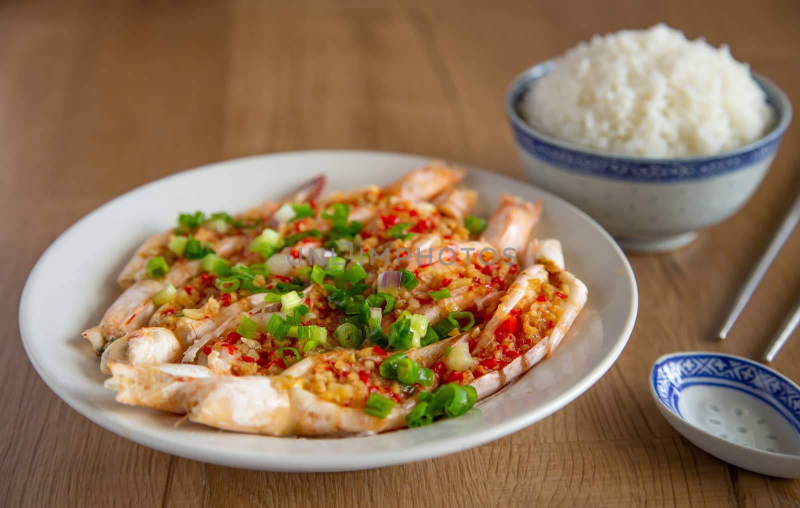 steam prawn with garlic and chilli on wooden background