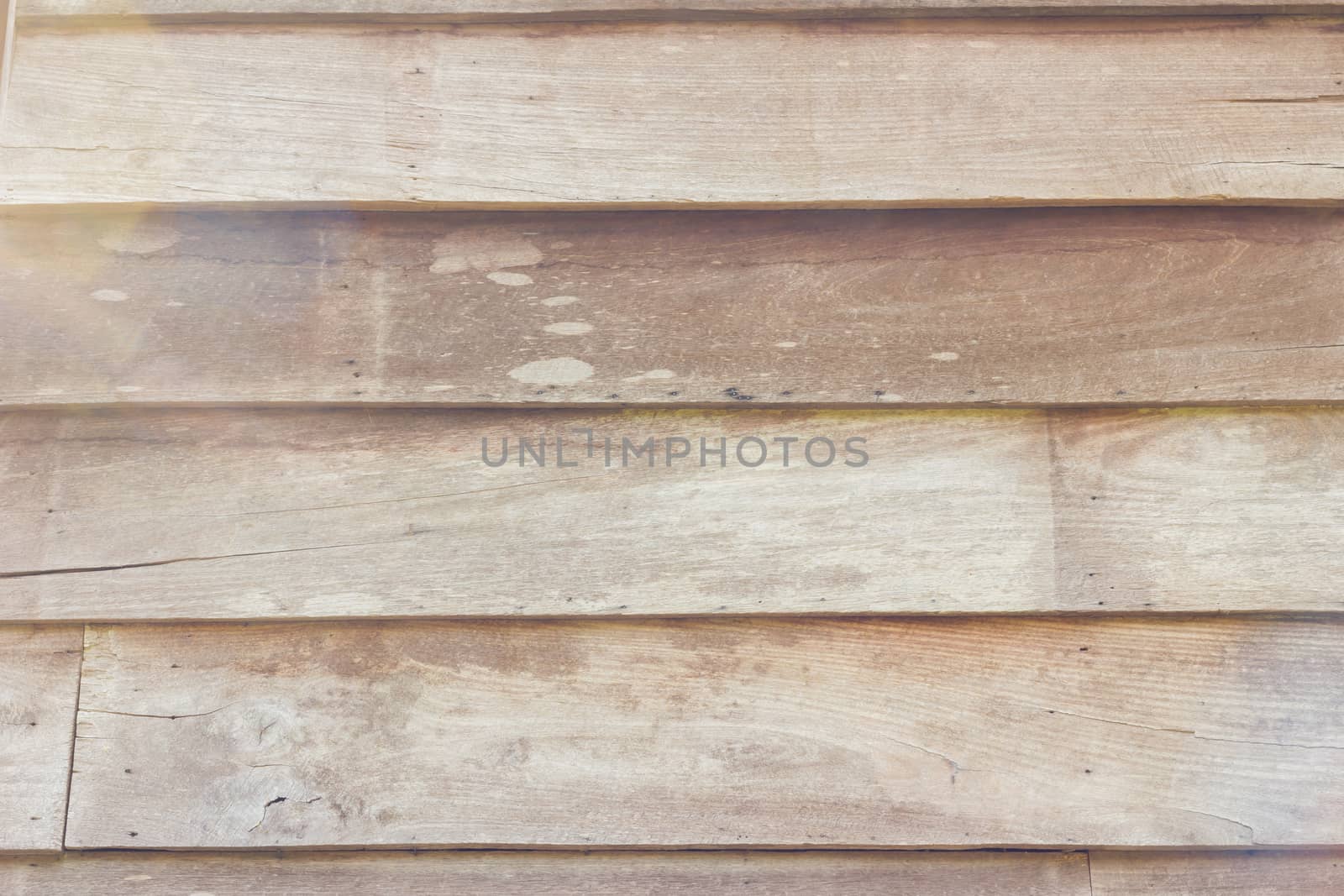 close-up brown color nature pattern detail of teak wood decorative furniture surface, horizontal strips