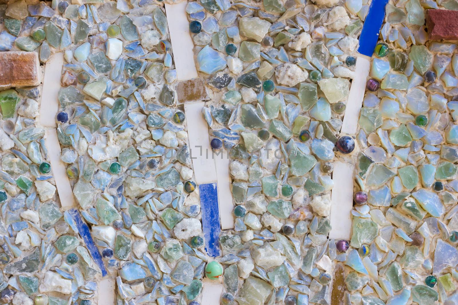 Colorful mosaic abstract background made of broken glass and ceramic pots.