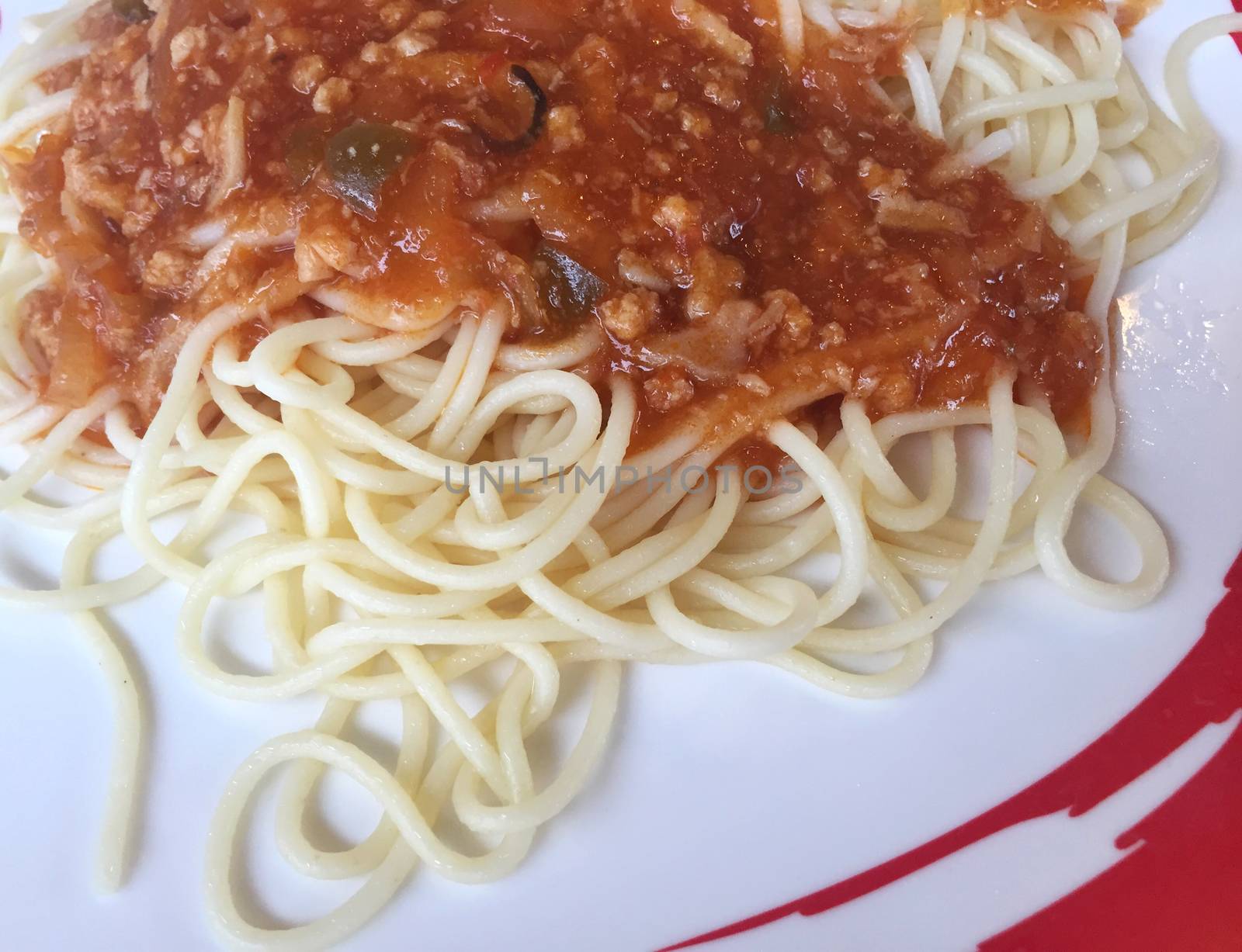 closeup spaghetti Bolognese with tomato sauce, copyspace. horizontal photo