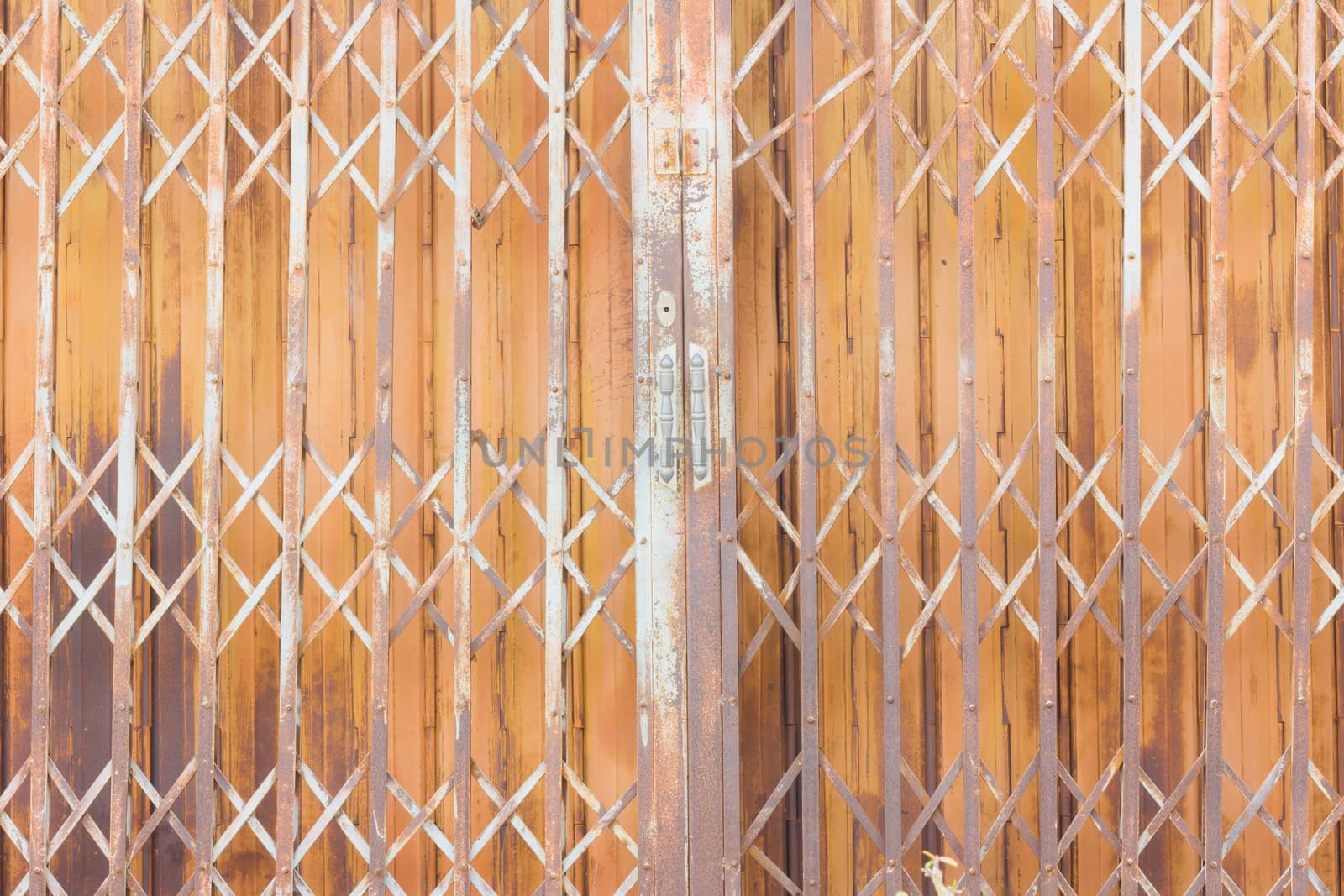 Old rusty steel vintage shutter door texture pattern and background, Thailand