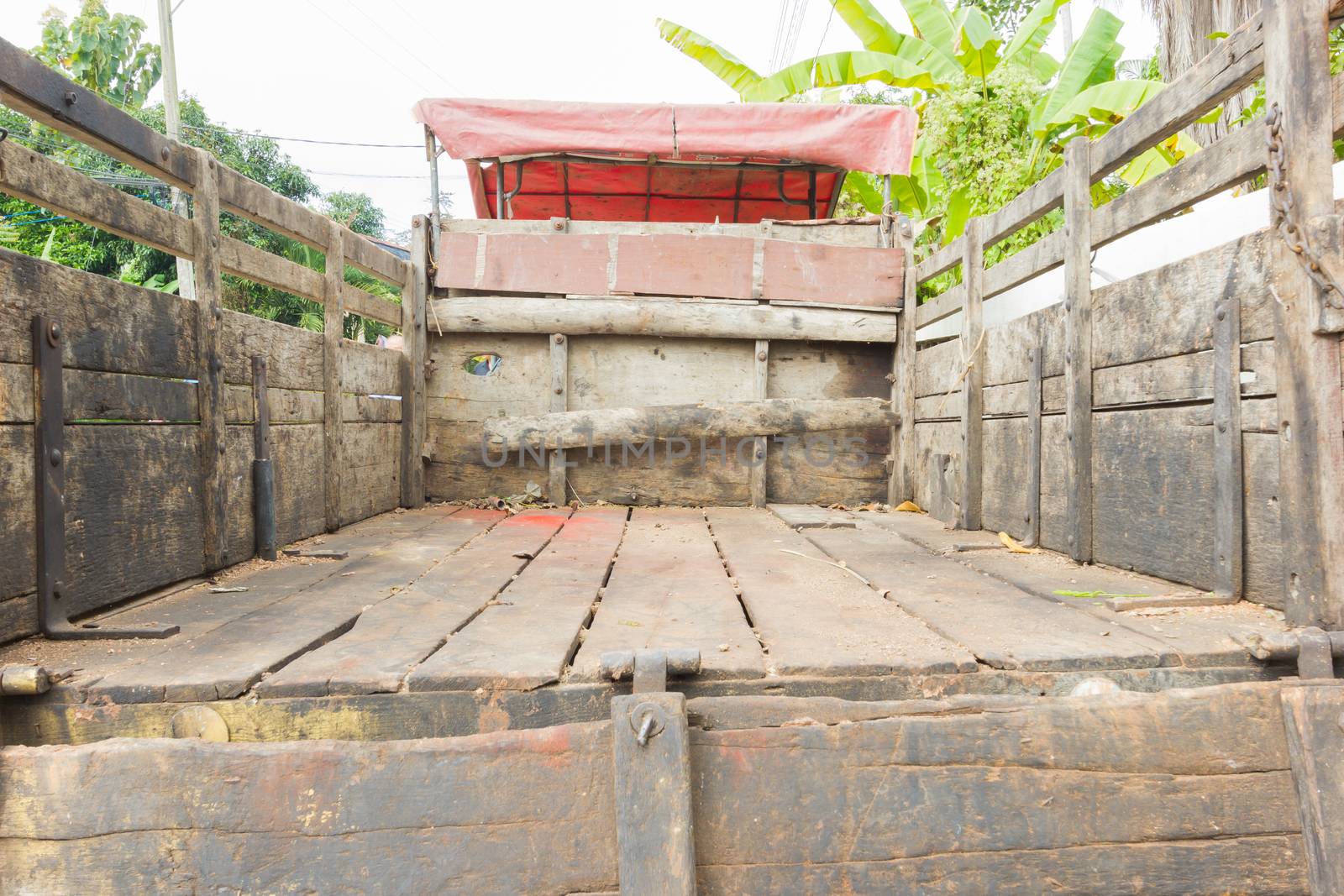 Rear view of a pick up truck made of wood. Perspective view