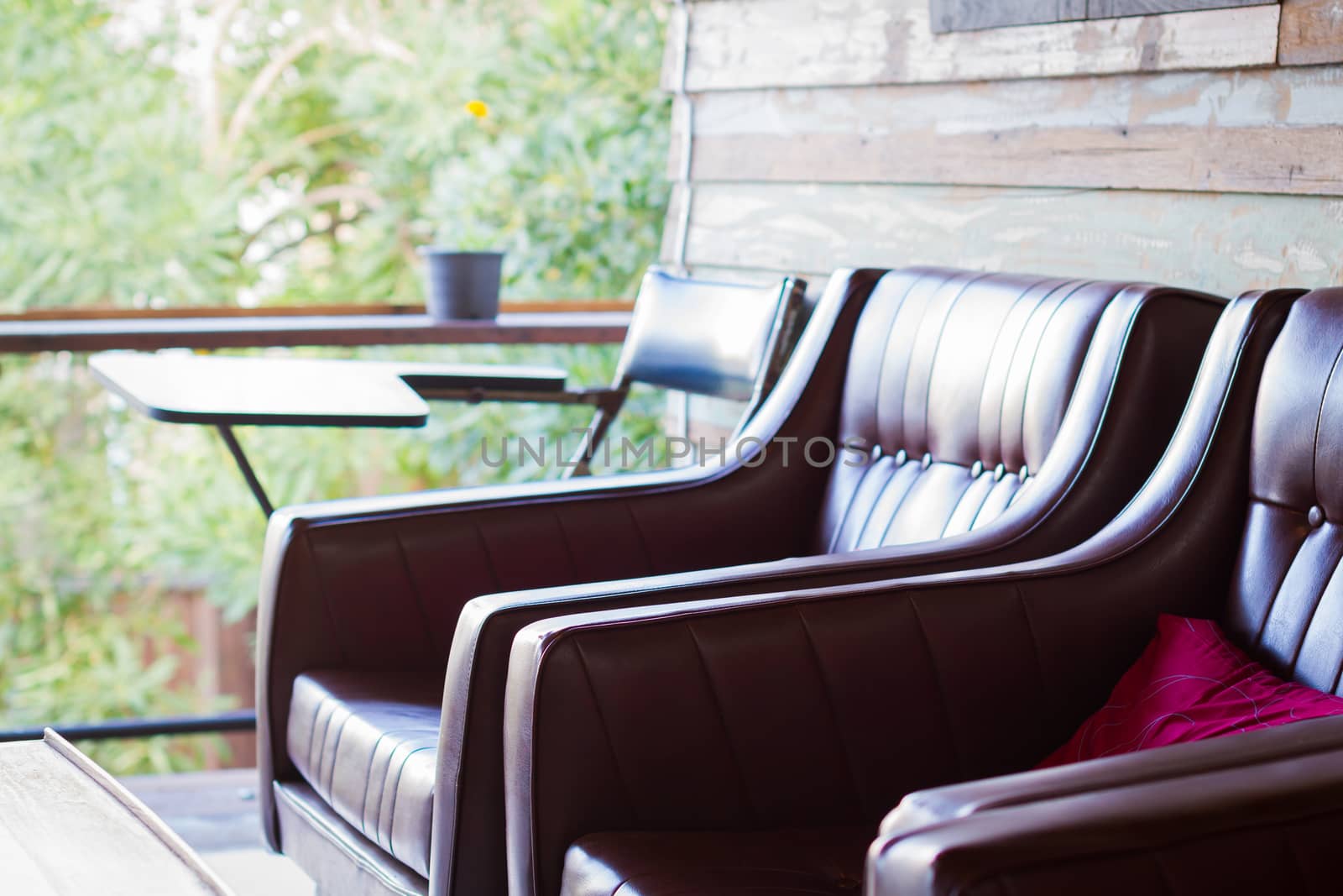 close-up brown sofa in wooden house with copyspace