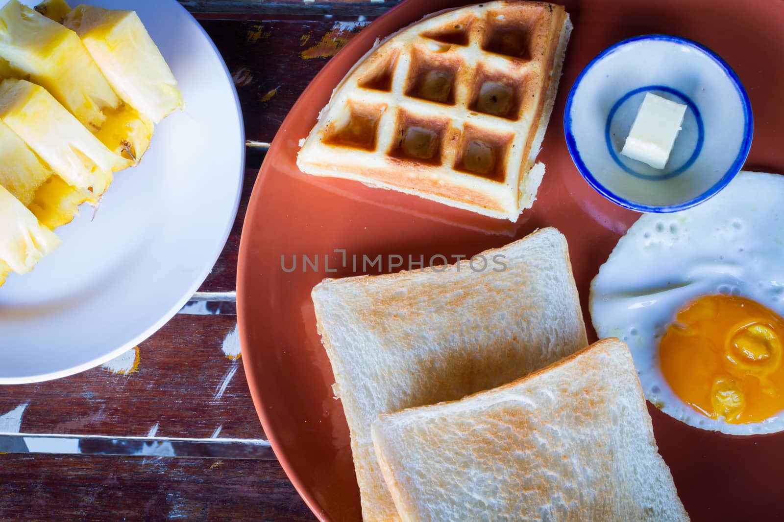 breakfast set of hotel in Thailand on wooden table. Top view.