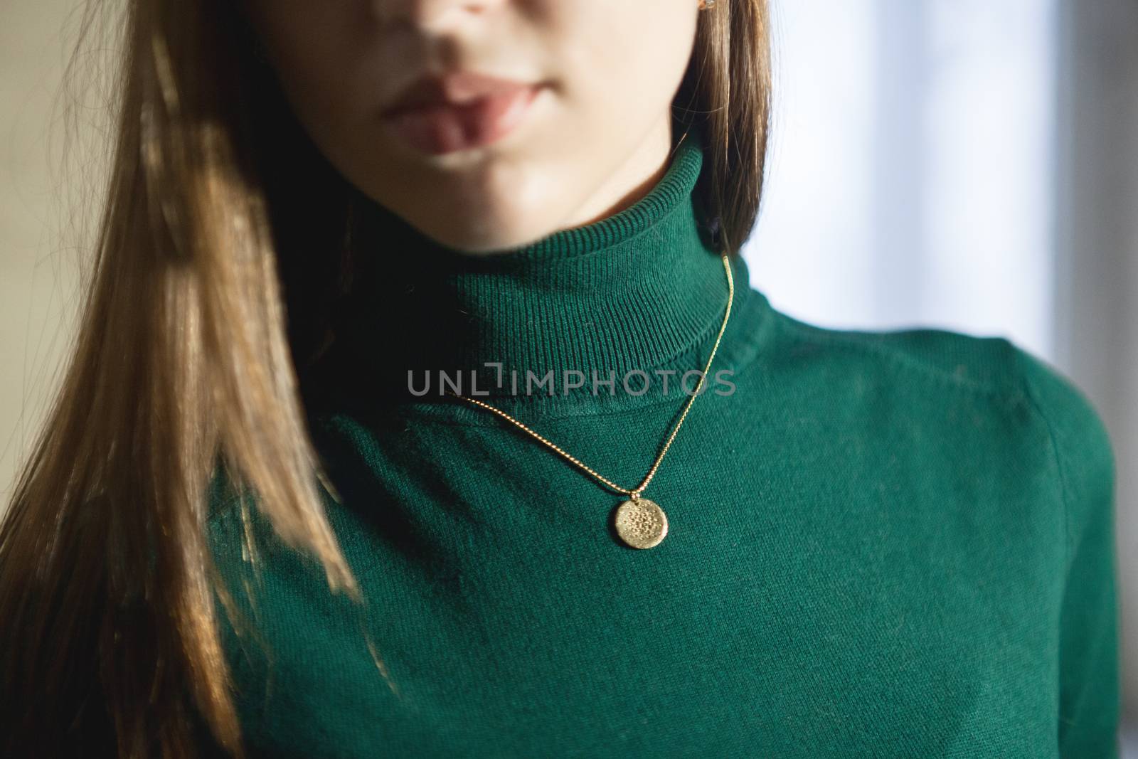 Portrait of beautiful fair young woman with fashion jewelry, one light source