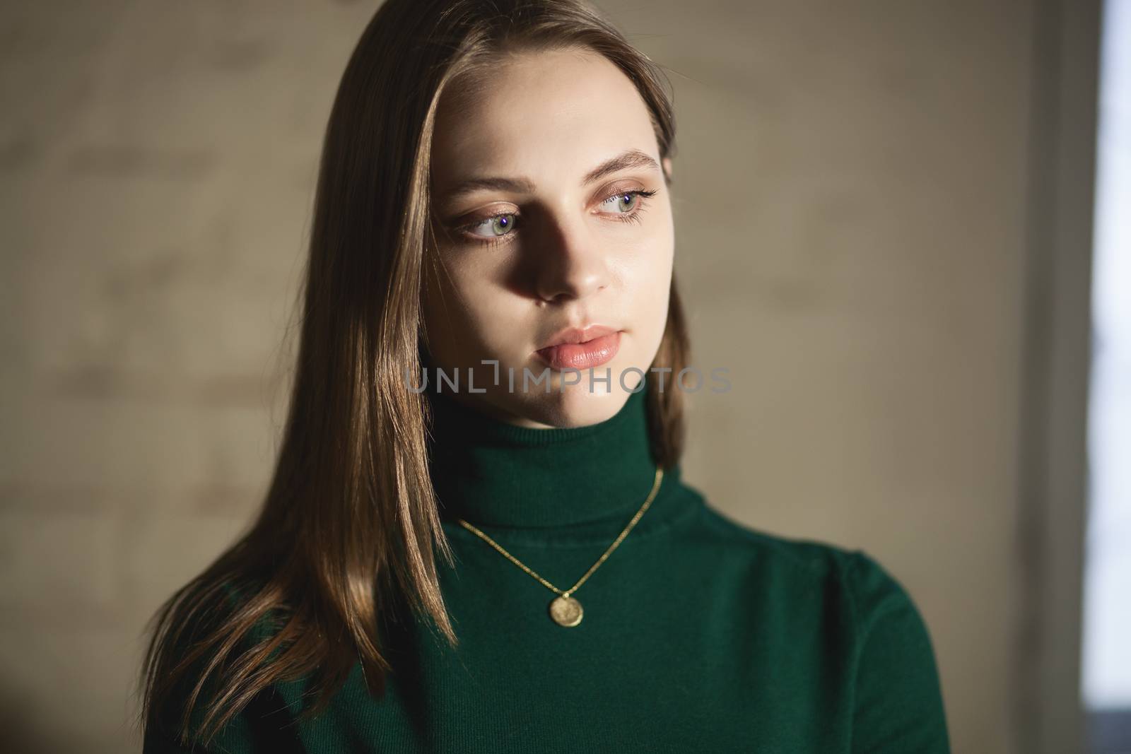 Portrait of beautiful fair young woman with fashion jewelry, one light source