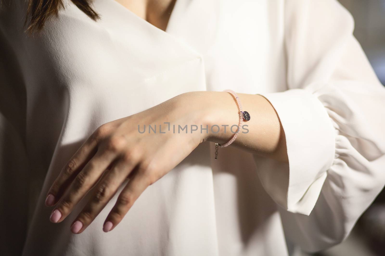Portrait of beautiful fair young woman with fashion jewelry, one light source