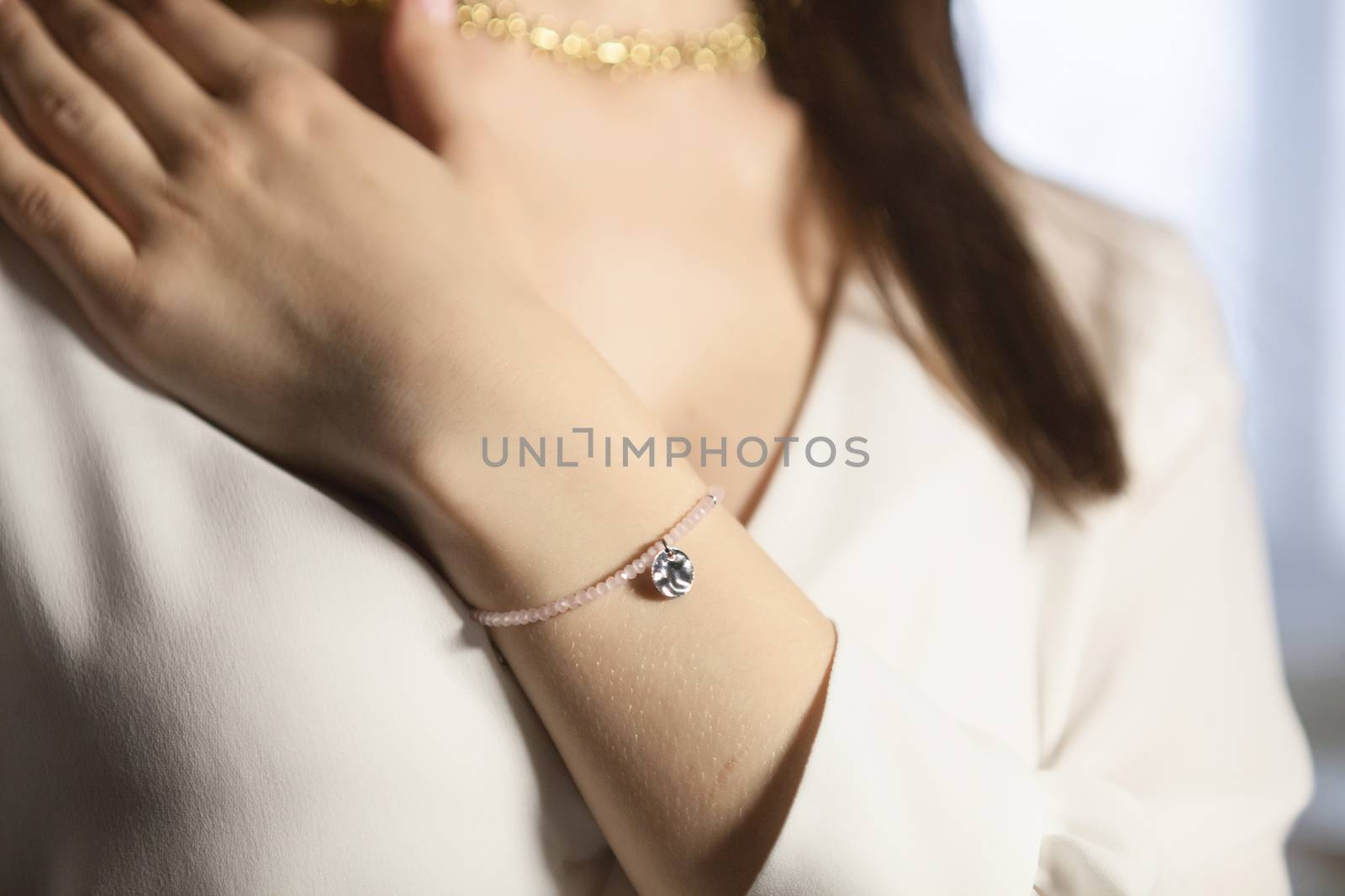 Portrait of beautiful fair young woman with fashion jewelry, one light source