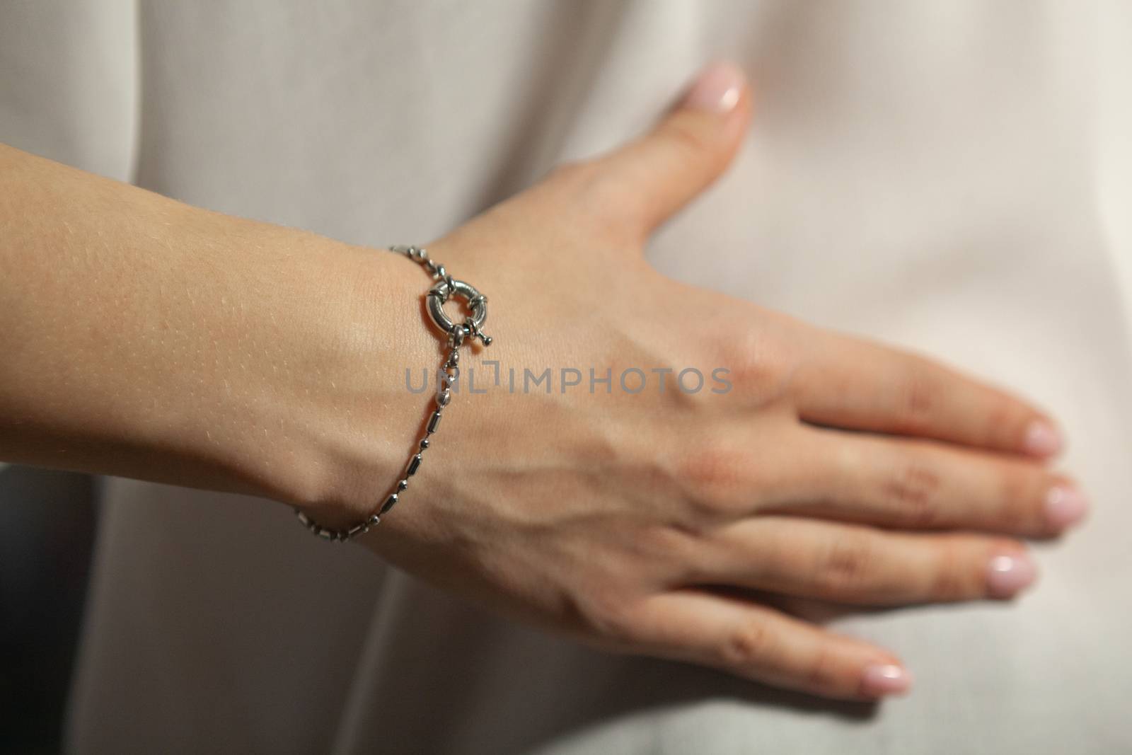 Portrait of beautiful fair young woman with fashion jewelry, one light source