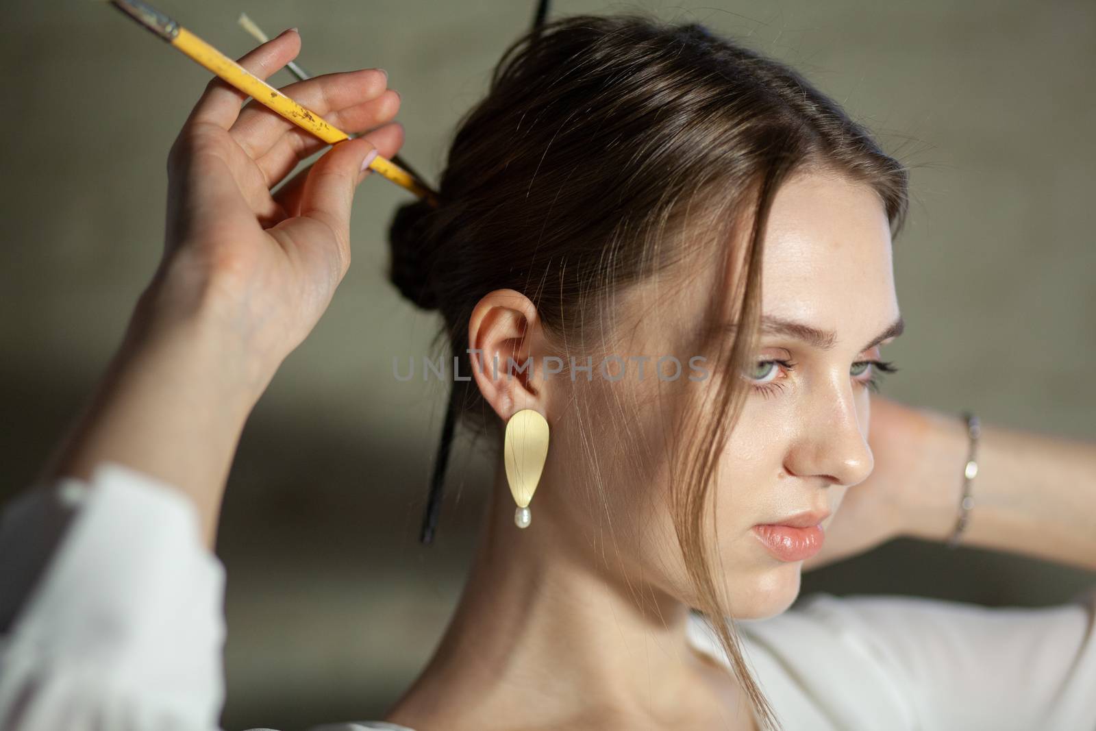 Portrait of beautiful fair young woman with fashion jewelry, one light source