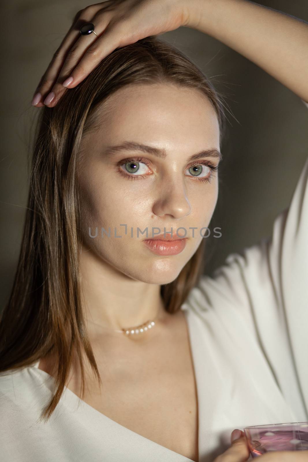 Portrait of beautiful fair young woman with fashion jewelry, one light source