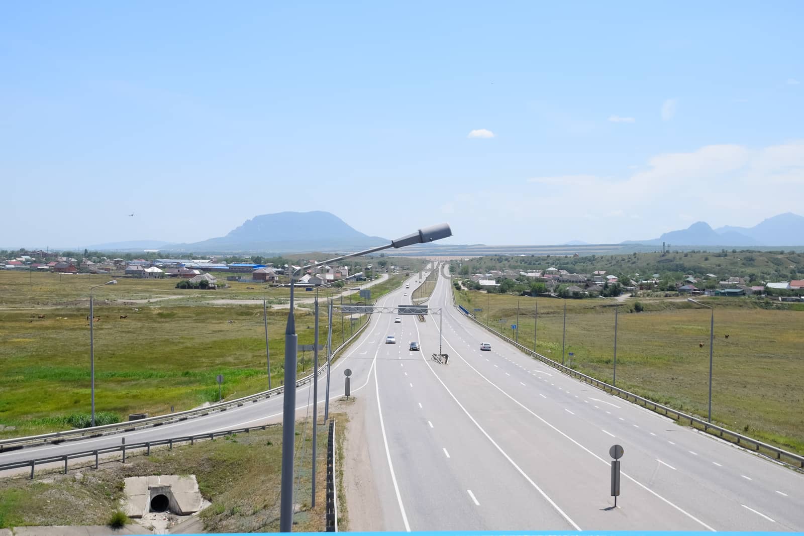 The road crossing is adjacent to the secondary road.