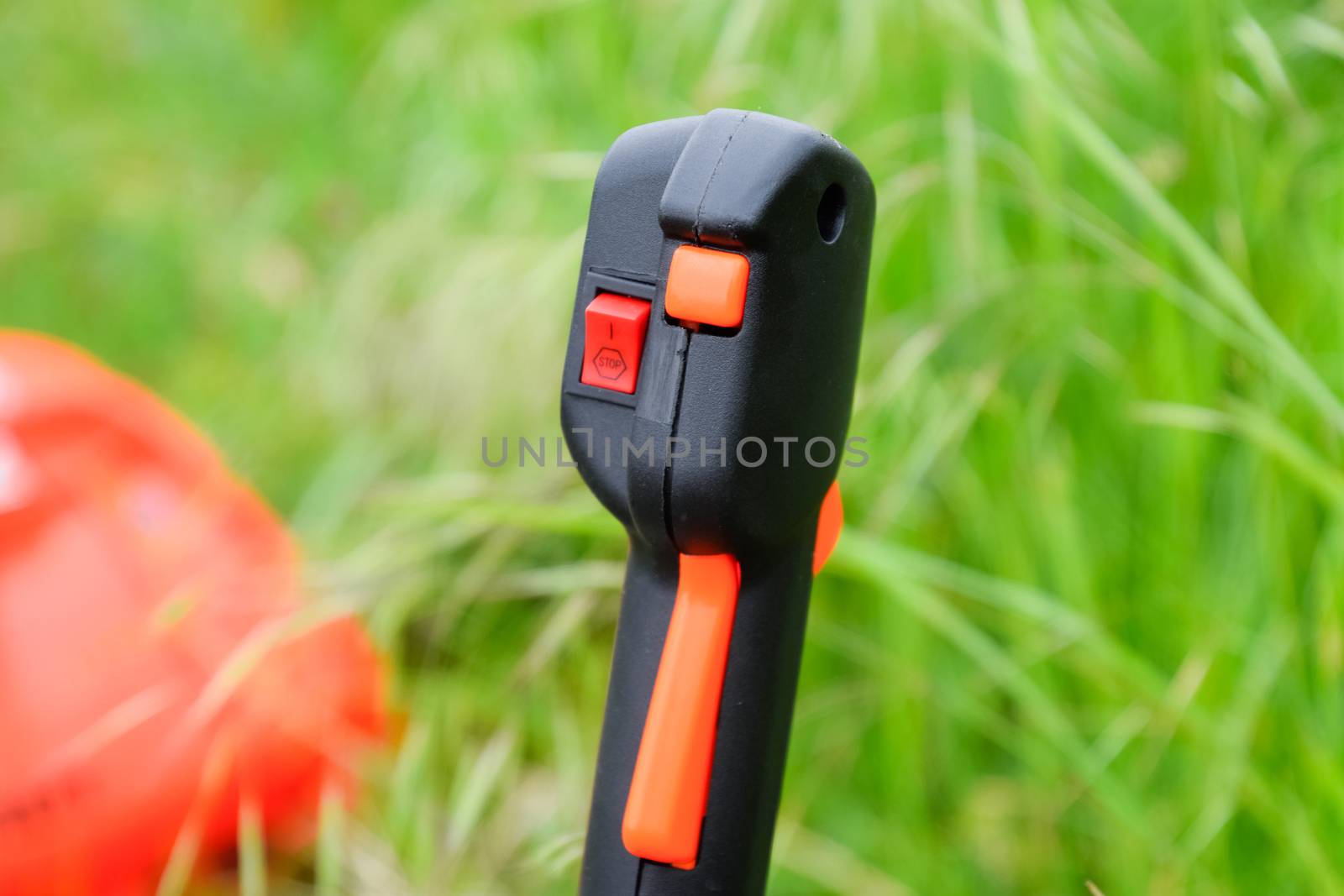 Knob with trimmer controls. Gas trimmer, equipment controls. Trimer gascosis with a leaf for mowing grass and shrubs.