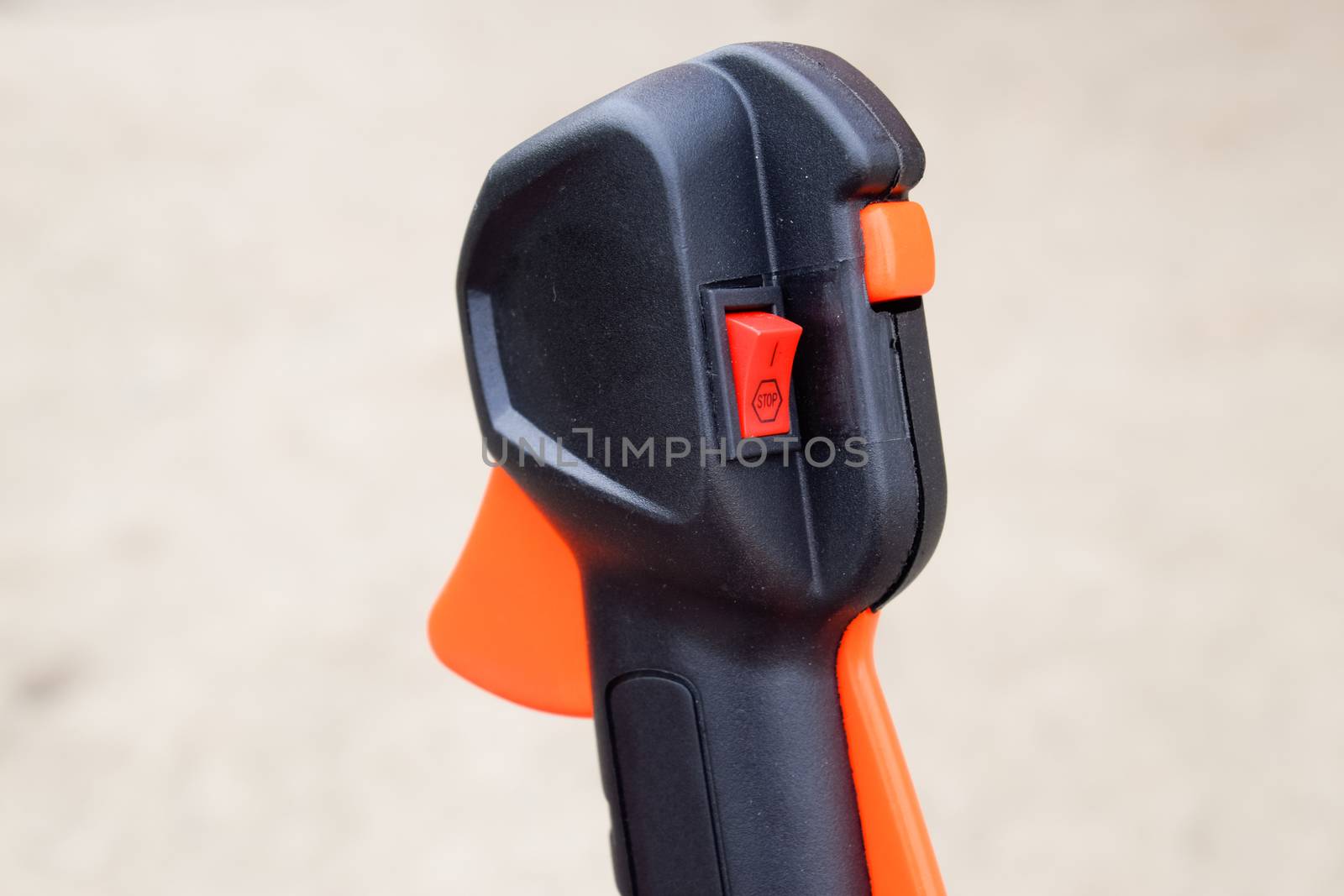Knob with trimmer controls. Gas trimmer, equipment controls. Trimer gascosis with a leaf for mowing grass and shrubs.