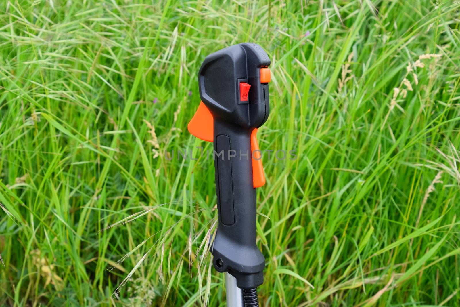 Knob with trimmer controls. Gas trimmer, equipment controls. Trimer gascosis with a leaf for mowing grass and shrubs.