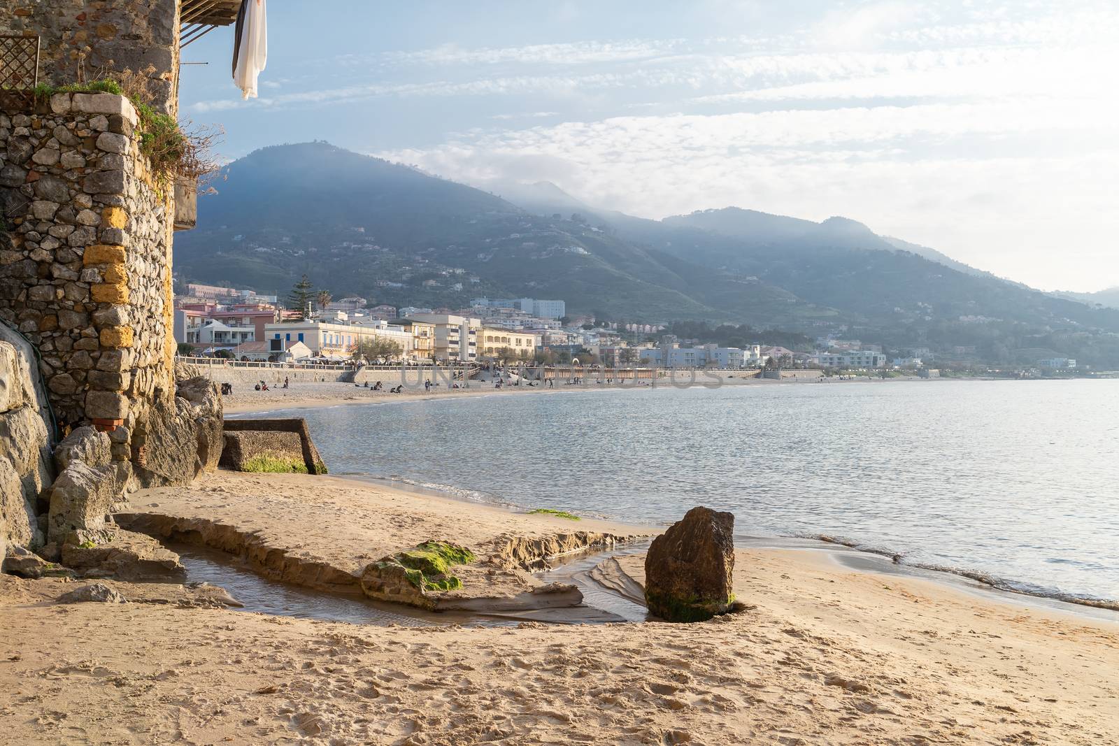 Idyllic view of long sandy beach with mountains in the background, seen from the old harbour on a sunny day in Cefalu, Sicily, Southern Italy. by tamas_gabor