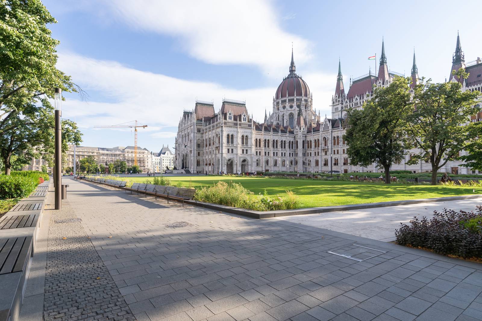 Hungarian parliament building and park from behind on a sunny day in summer season, angled view in Budapest, Hungary. by tamas_gabor