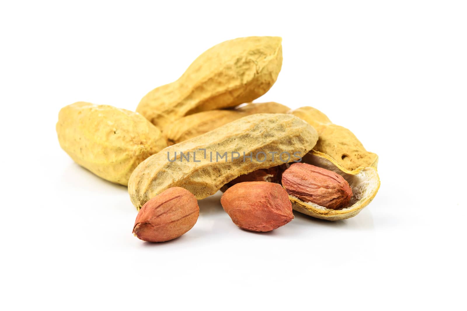 Dried peanuts isolated on the white background in close-up