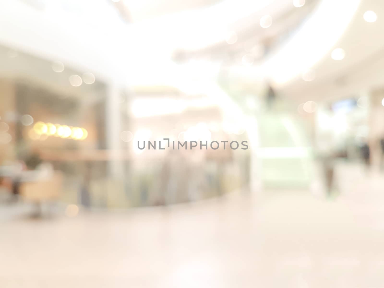 Beautifully blurred bright shopping center background with bokeh effect.