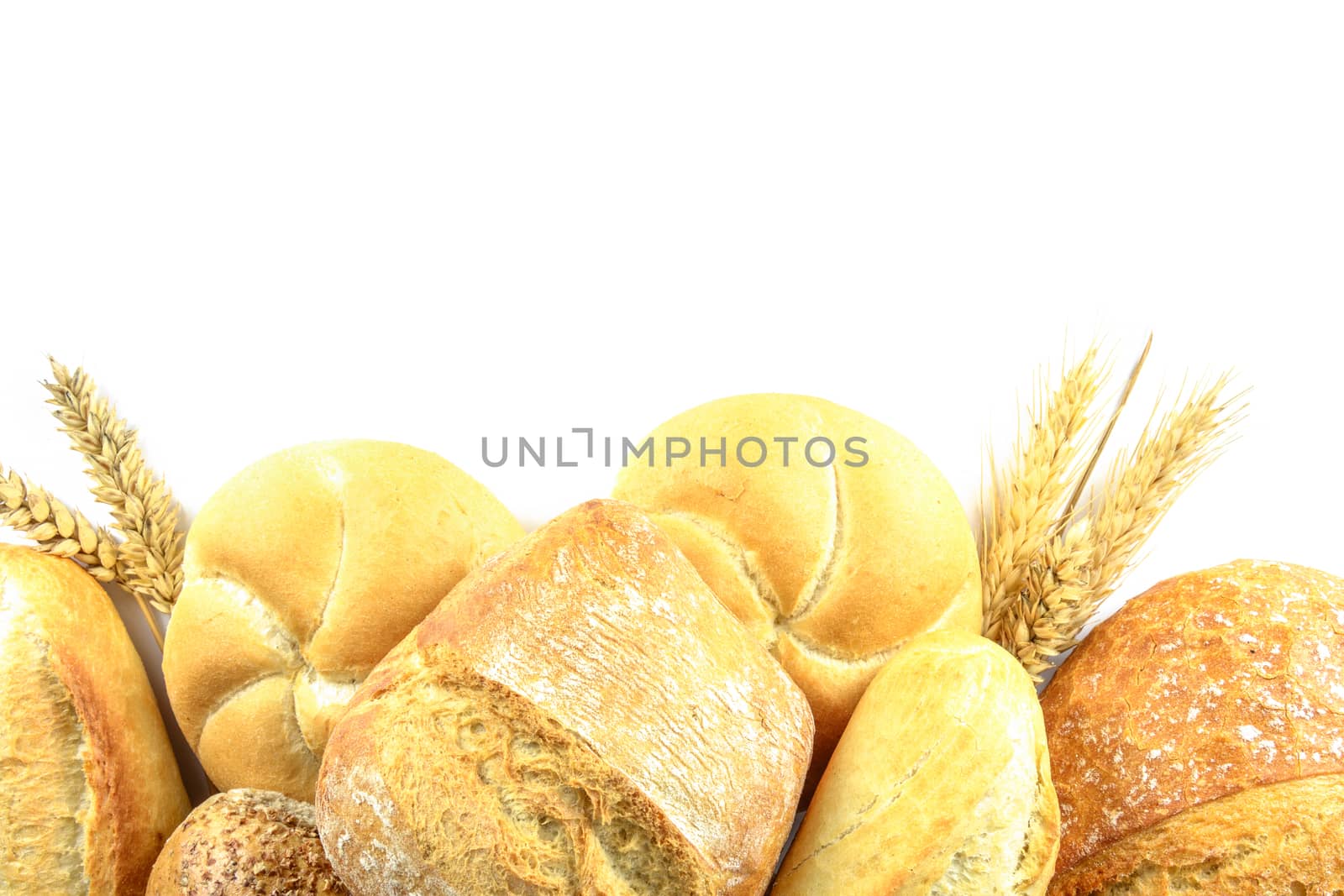 Top view of a variety fresh breads and isolated on a white background with copy space.