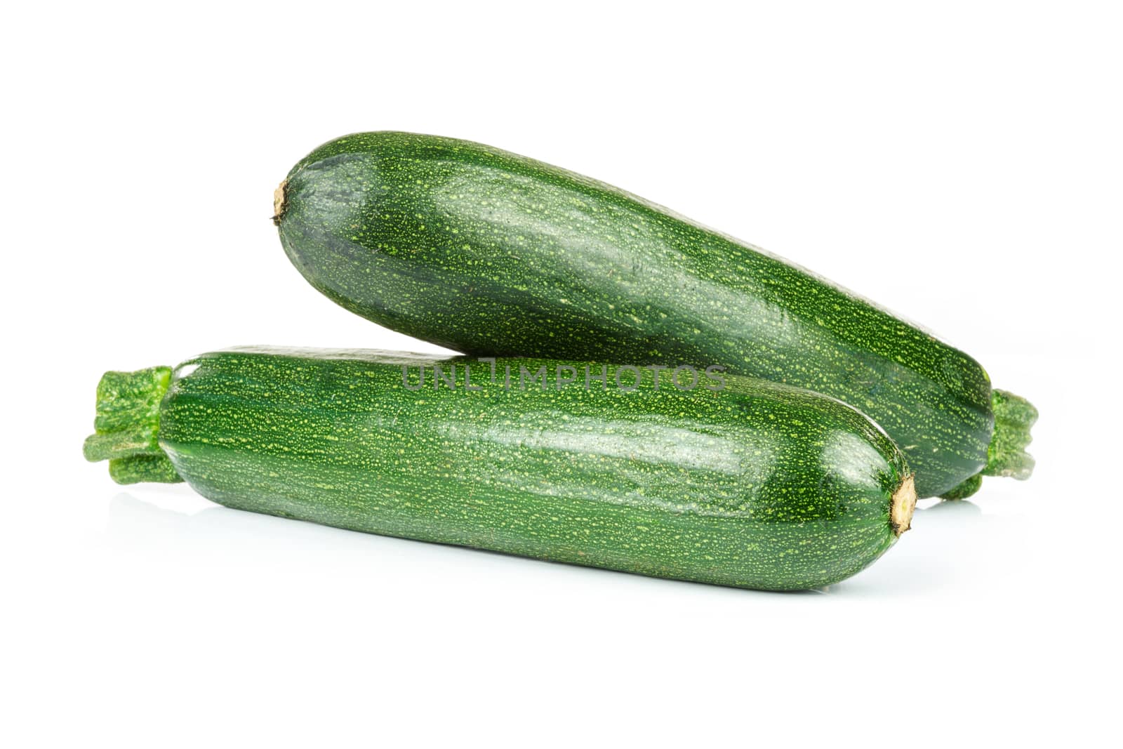 Zucchini courgette isolated on a white background in close-up.