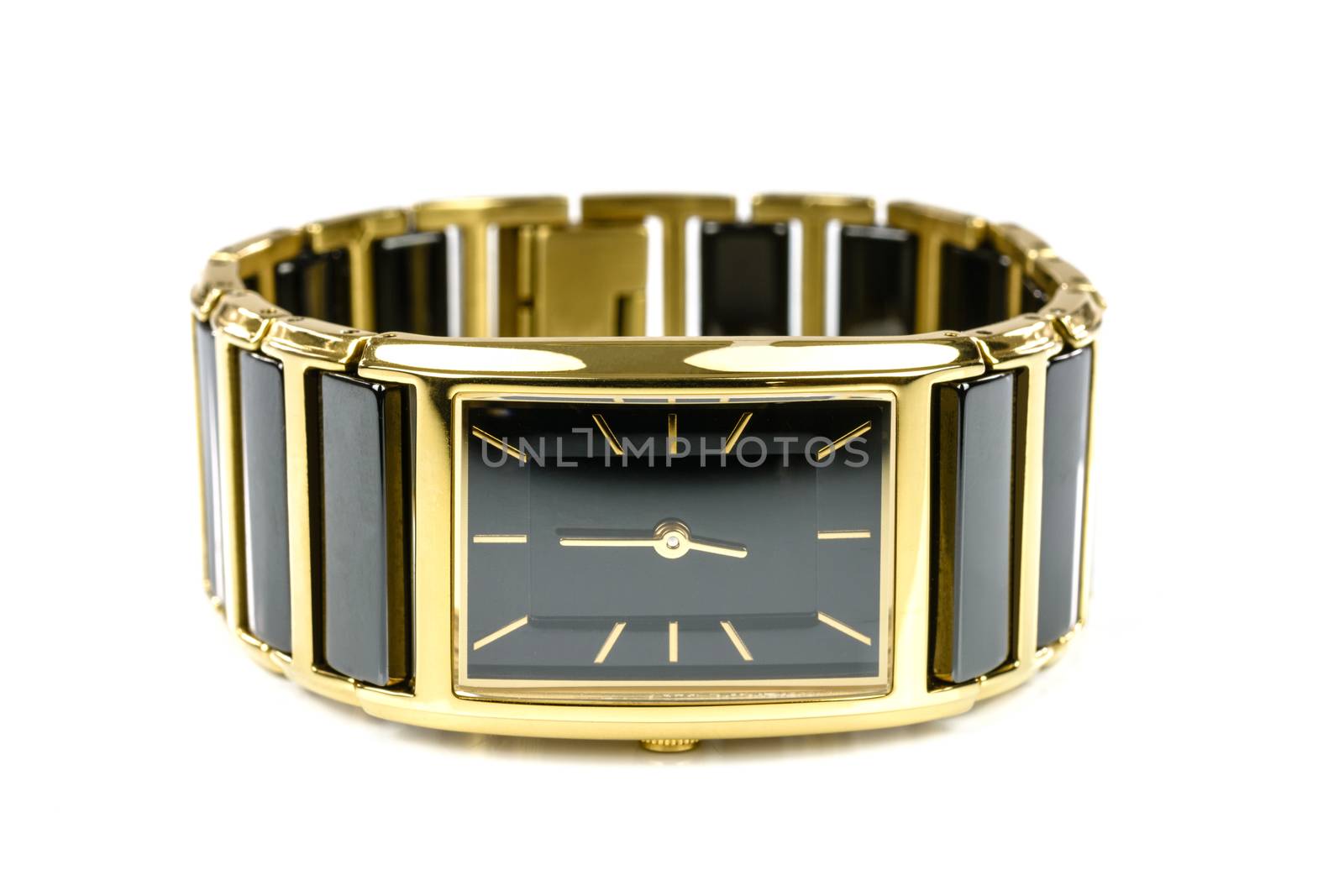 Elegant female gold watch isolated on a white background in close-up