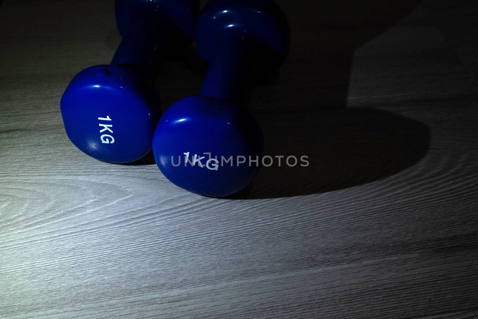 Blue dumbbells on the floor by SemFid