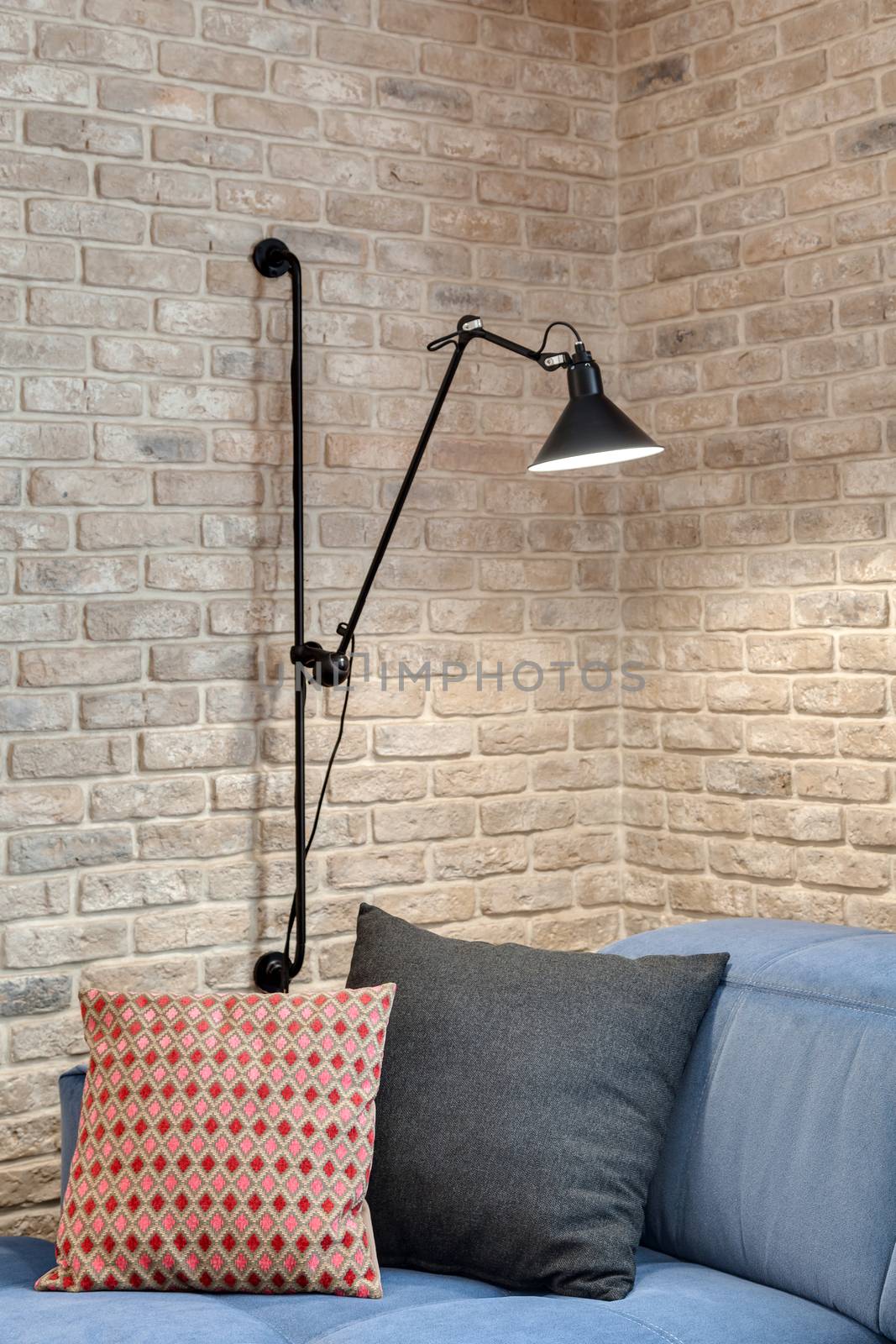 Fragment of a modern room with a brick wall by sveter