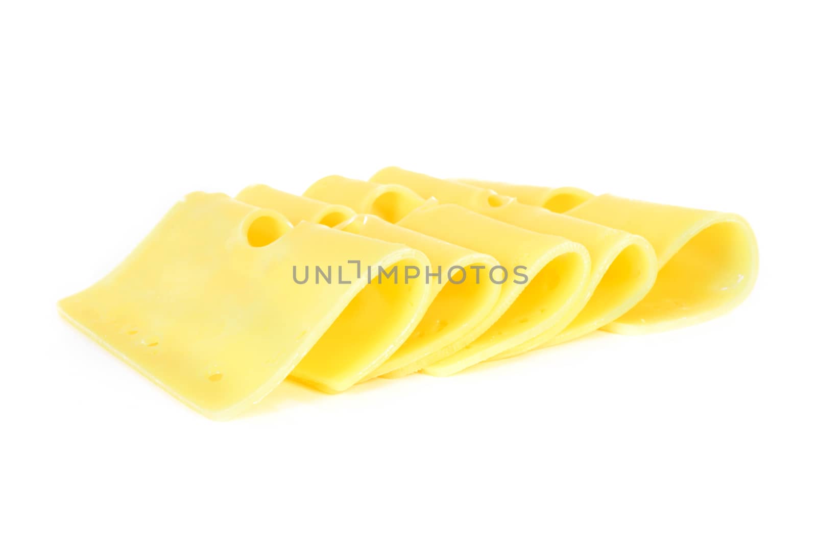 Pieces of fresh yellow cheese isolated on a white background in close-up