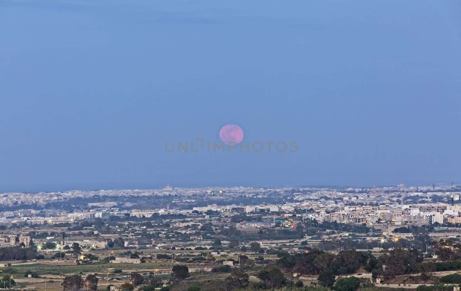 The Super Flower Moon rising over the Maltese landscape in May 2020.