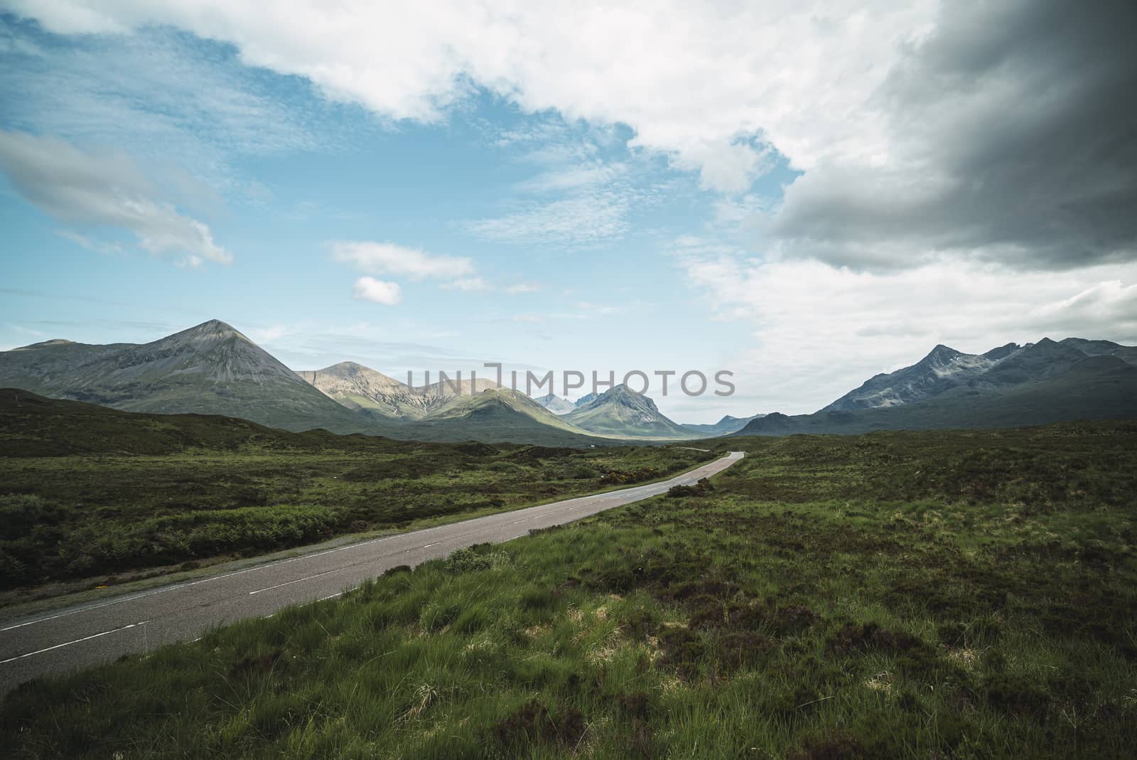 Beautiful landscape of the highlands in Scotland with mountains and a road