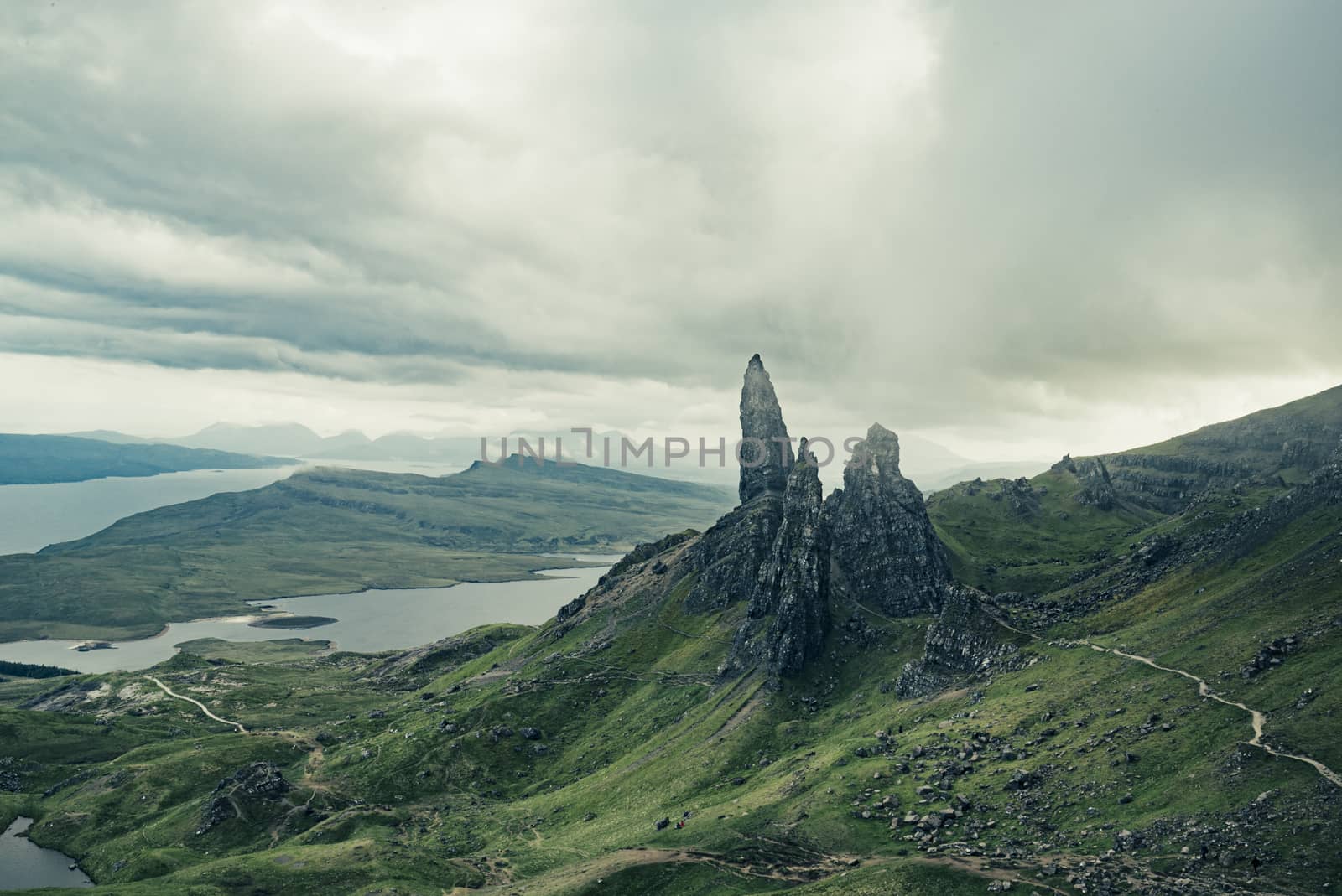 Landscape of Old Man of Storr in Scotland with fog and clouds in aerial shot