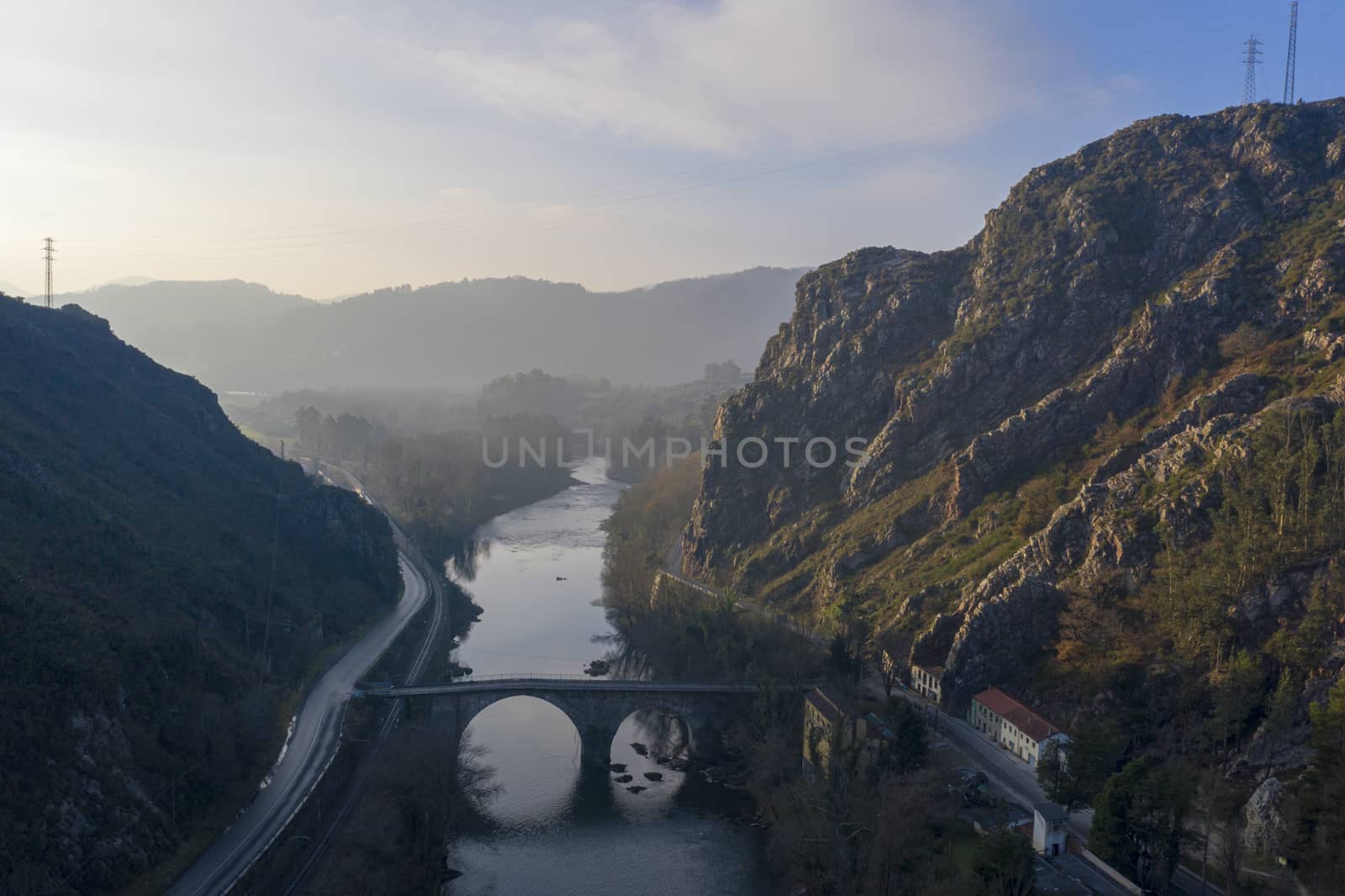 Aerial landscape of a bridge and a river in sunset