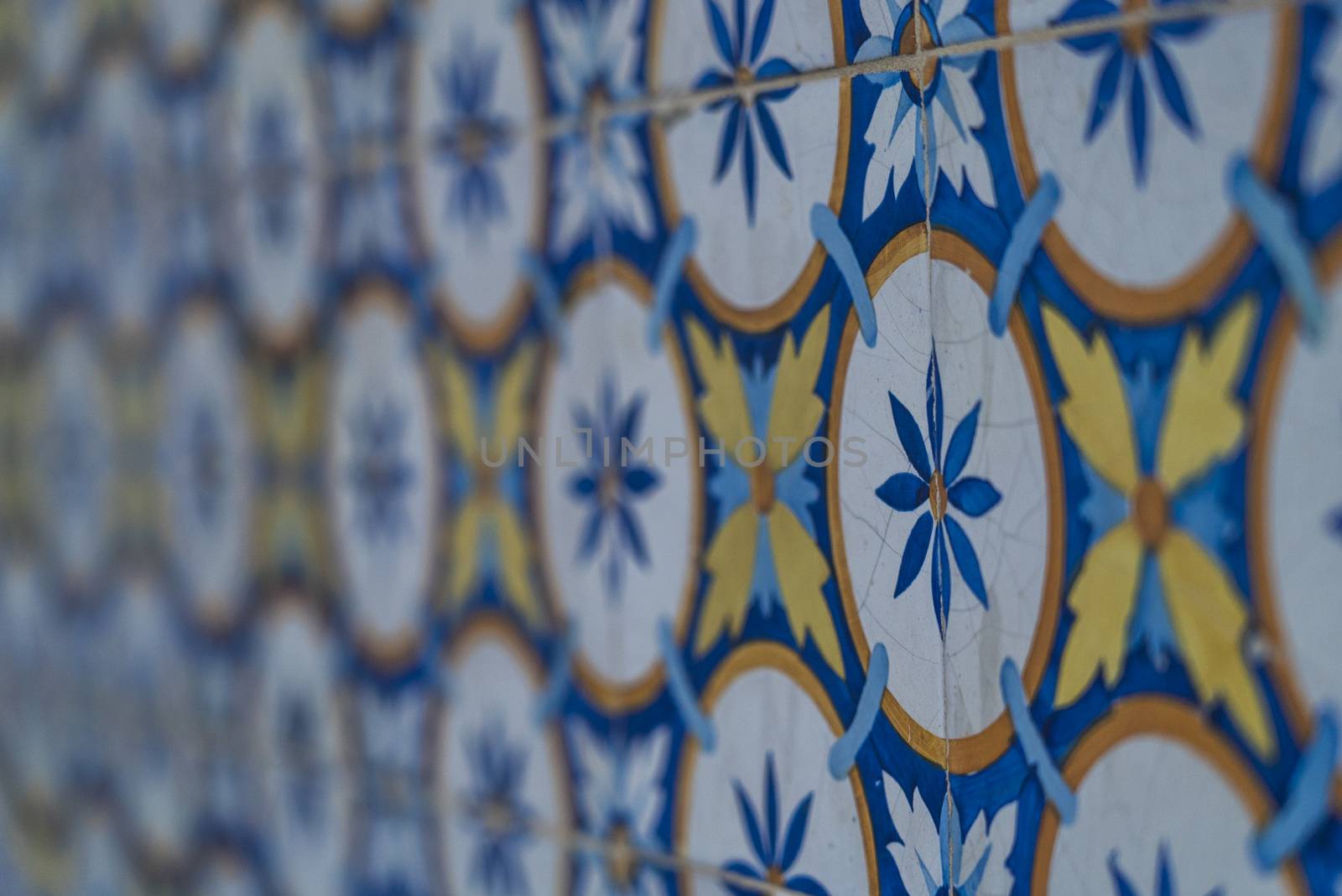 blue white and yellow lisbon tiles hand made flower pattern