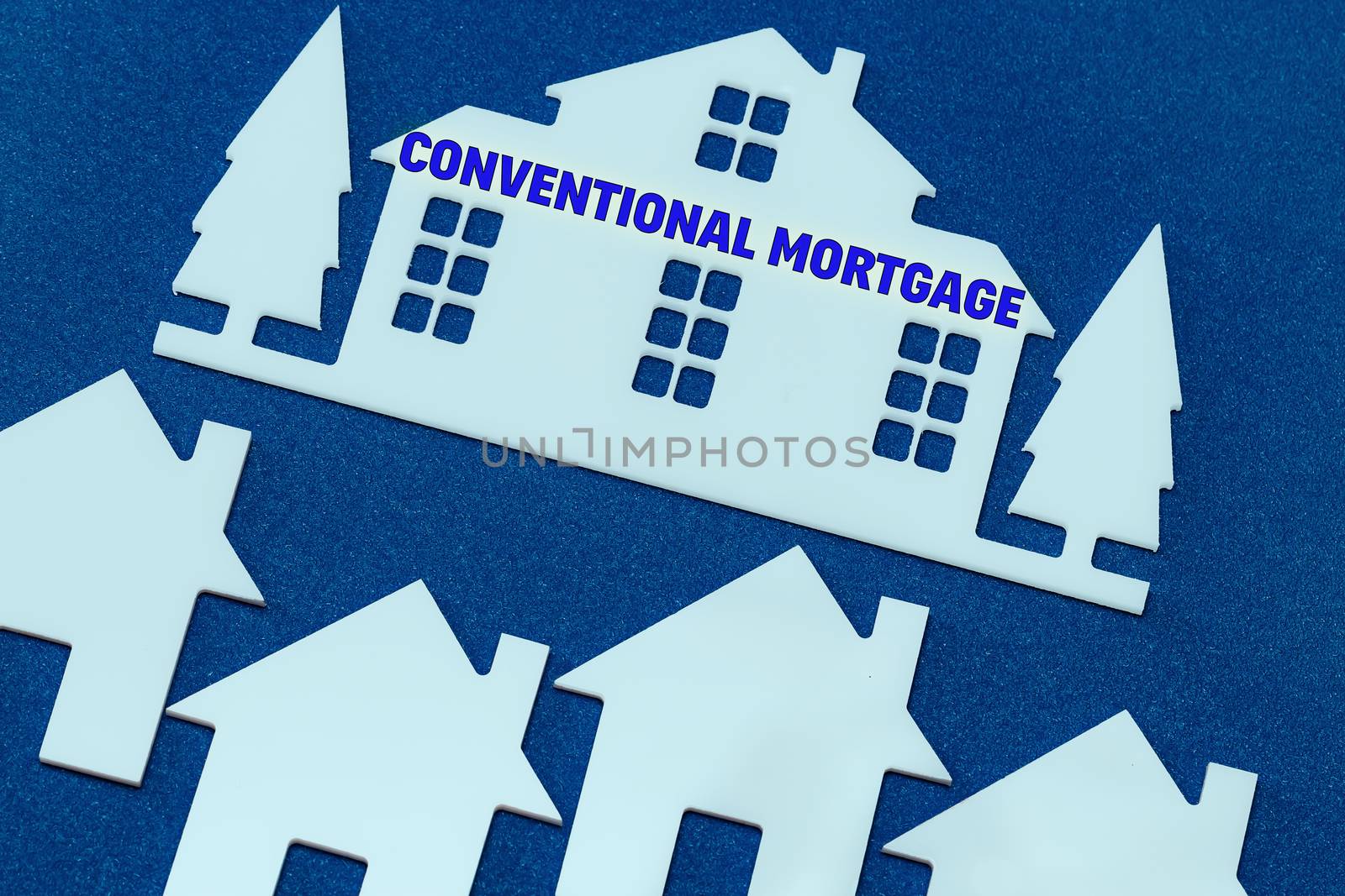 toy houses on a blue background. Text Conventional mortgage. by bonilook