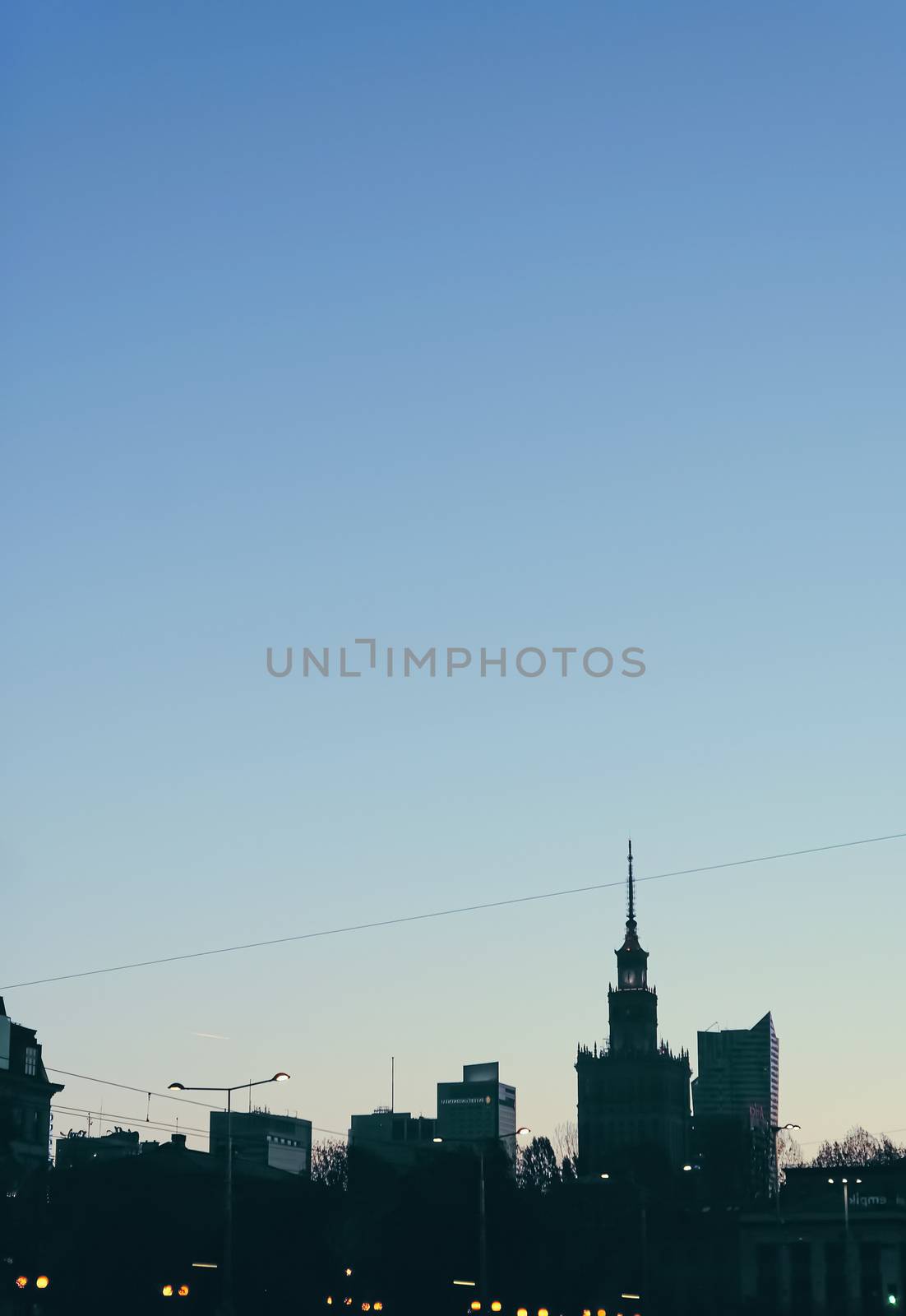 Cityscape silhouette of a European city as background, evening view of Warsaw, Poland