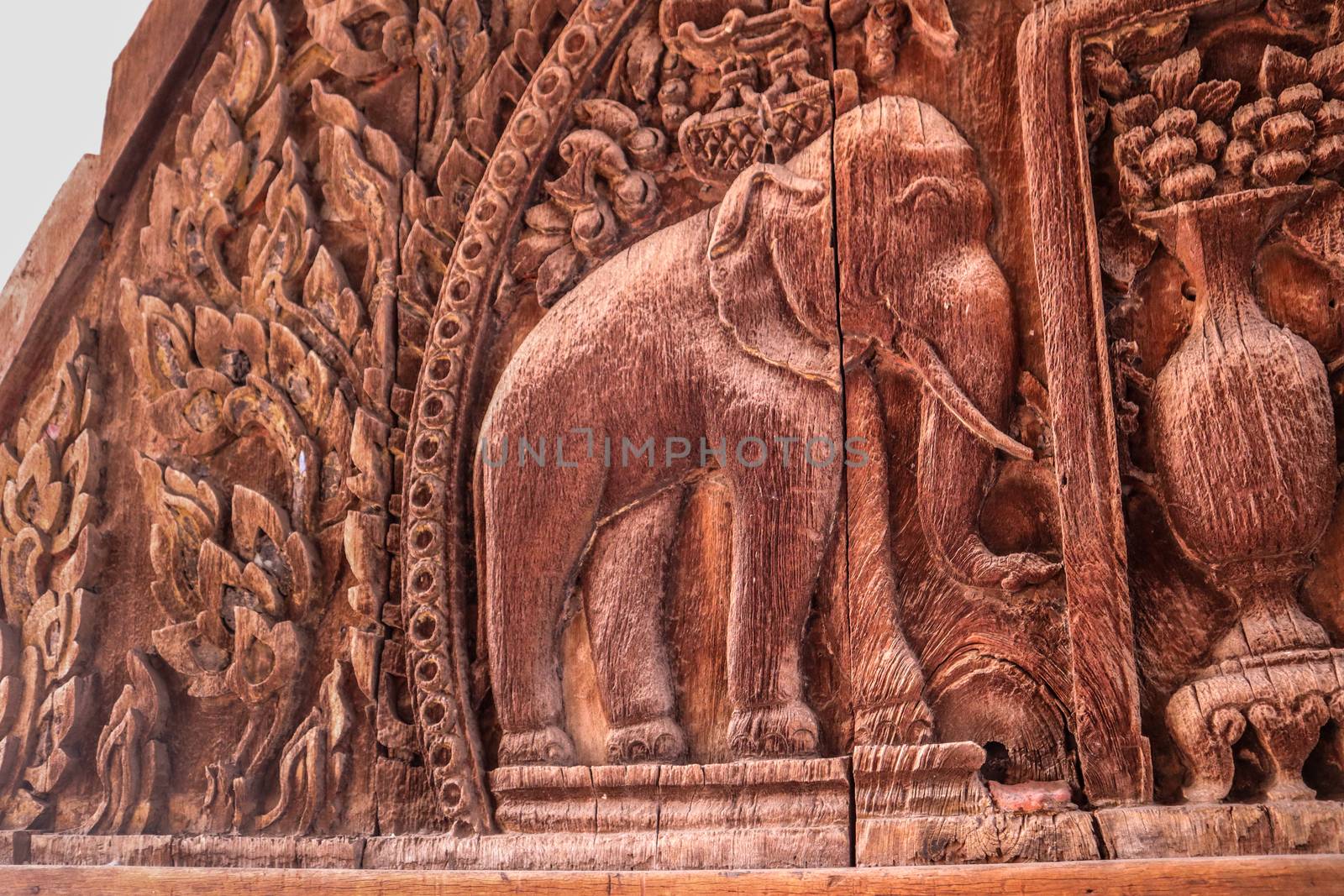 Elephant depiction.Piece of wood curving art, Isolated vintage pattern curved in wood