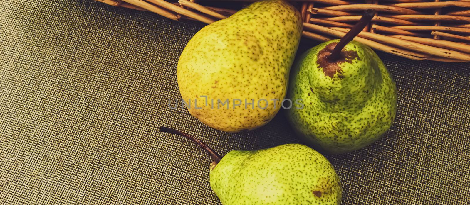 Organic pears on rustic linen background by Anneleven