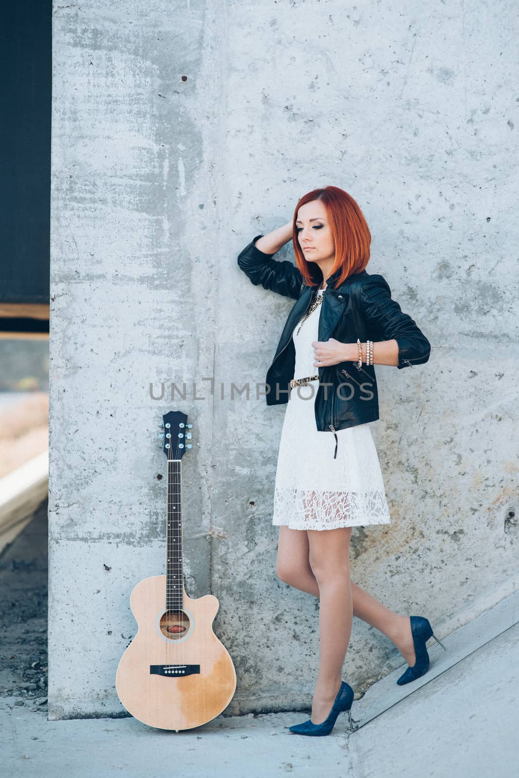 young girl with red hair with an acoustic guitar by Andreua