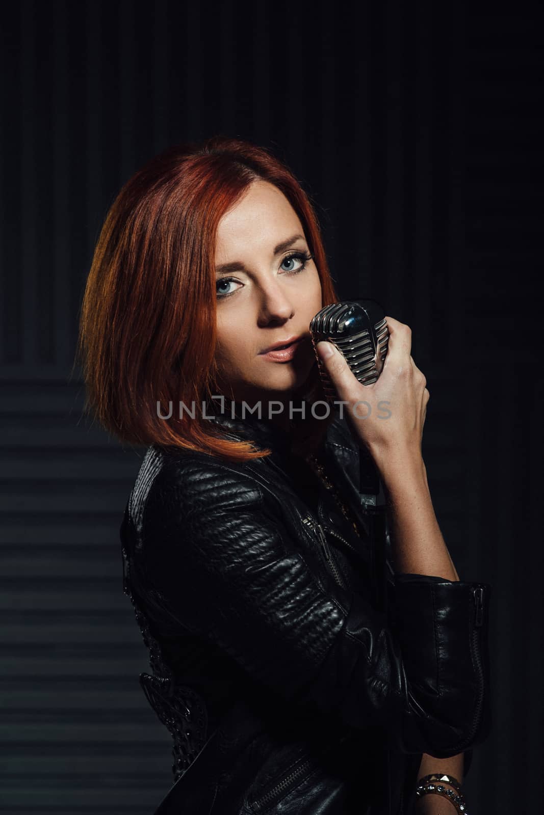 young red-haired girl in a white dress and a black leather rocke by Andreua