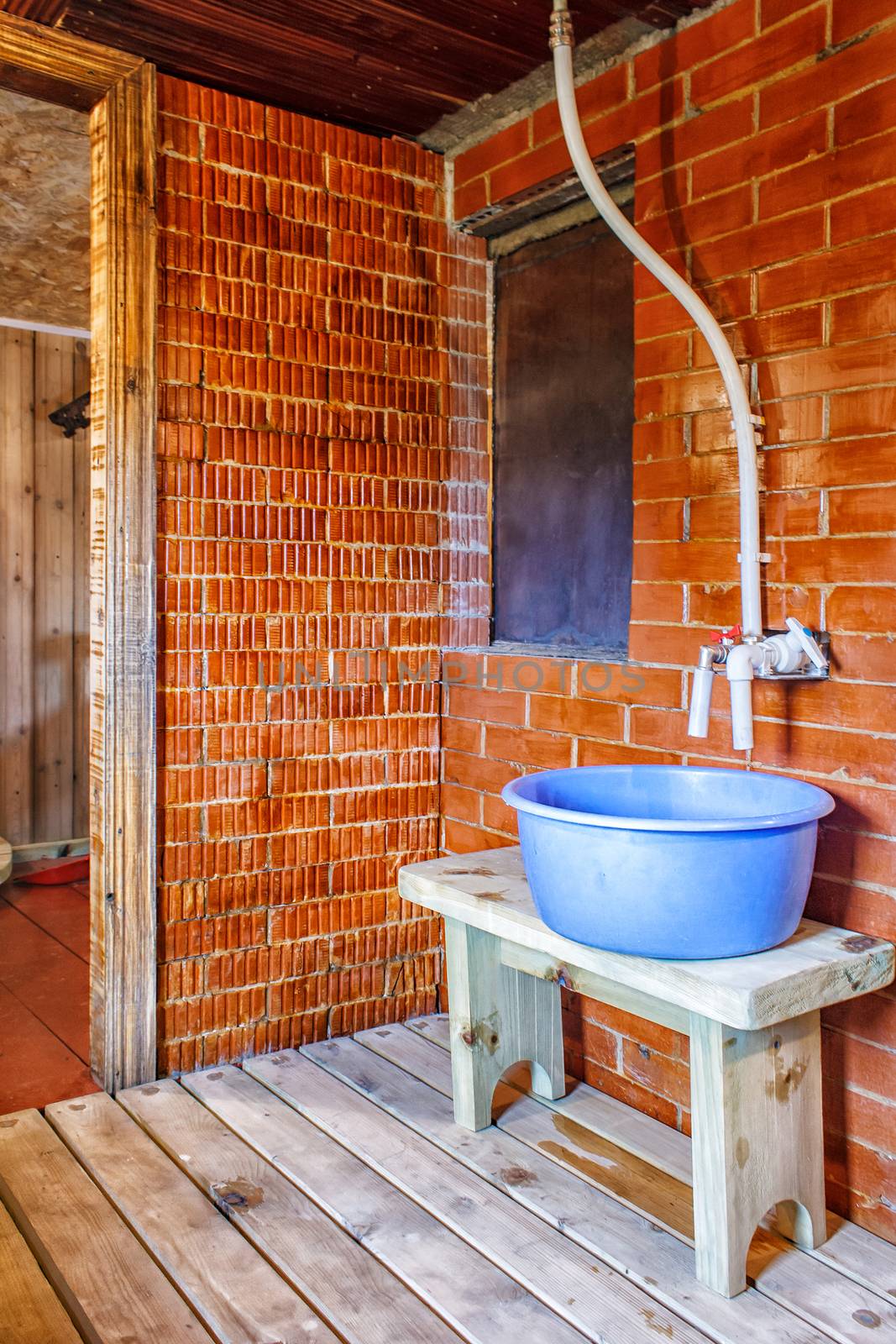 interior a rustic bath with blue tub