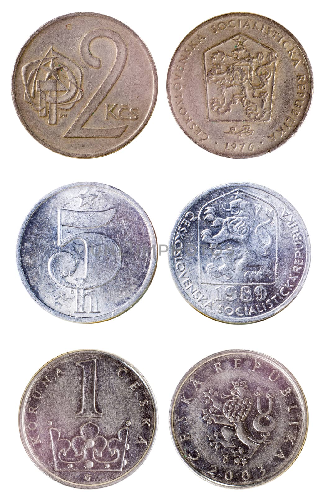 three different old czech coins isolated on white background