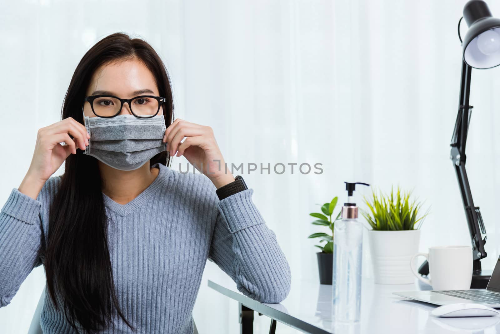 Business woman during wearing face mask protective working from  by Sorapop