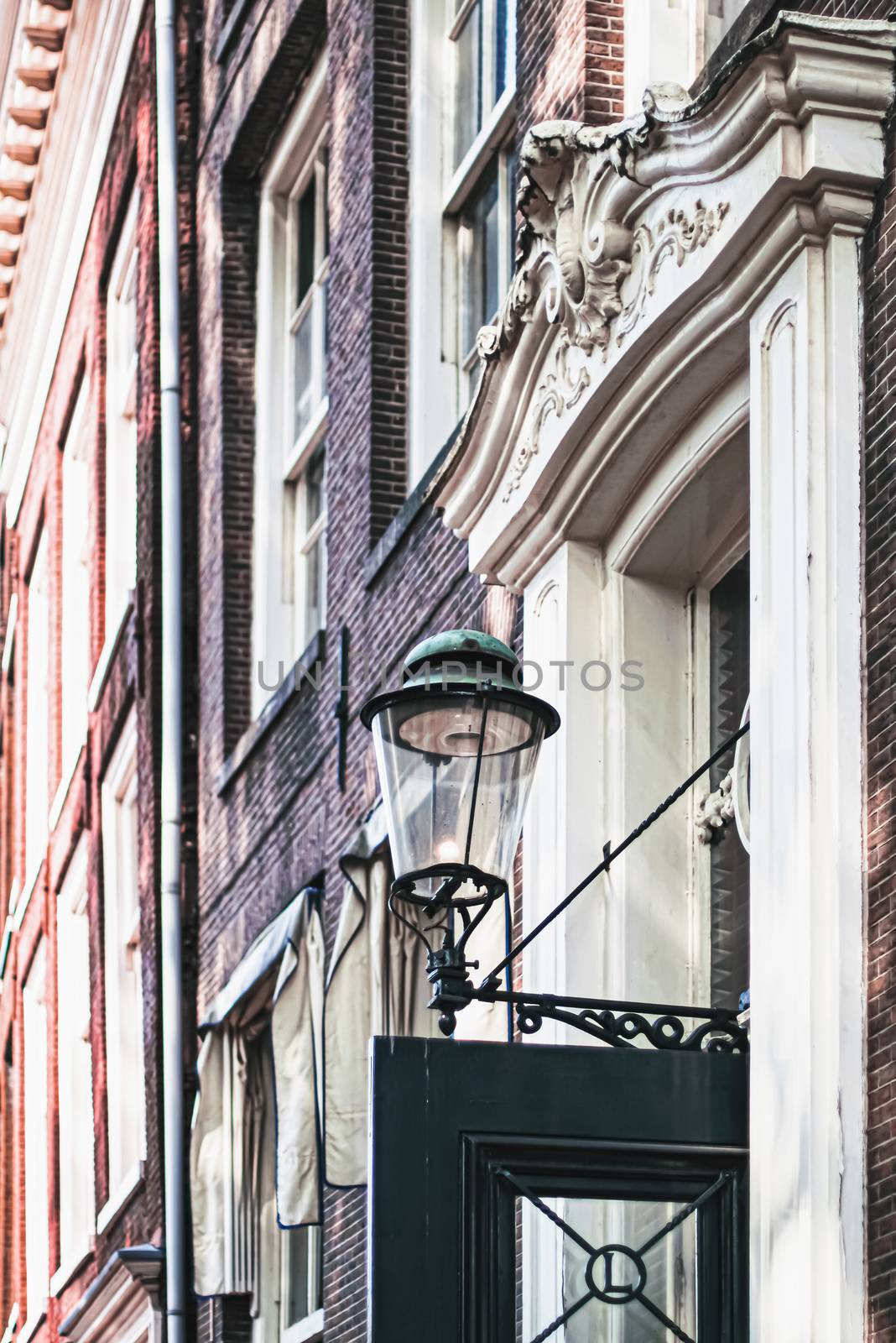 Architectural detail of a building on the main city center street of Amsterdam in Netherlands, european architecture