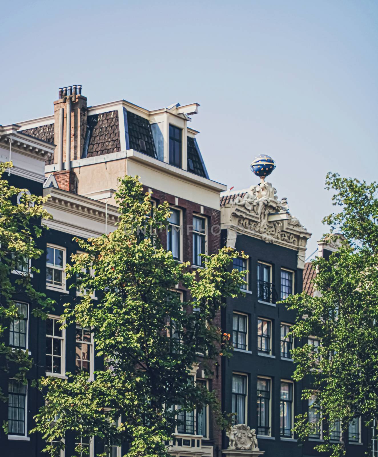 Main downtown street in the city center of Amsterdam in Netherlands by Anneleven