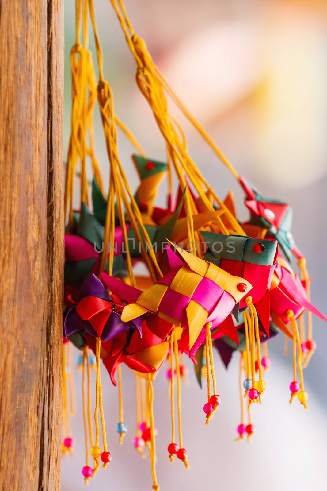 Sale of souvenirs in the market, Siem Reap, Cambodia. Funny handmade fishes with bright colorful ropes.