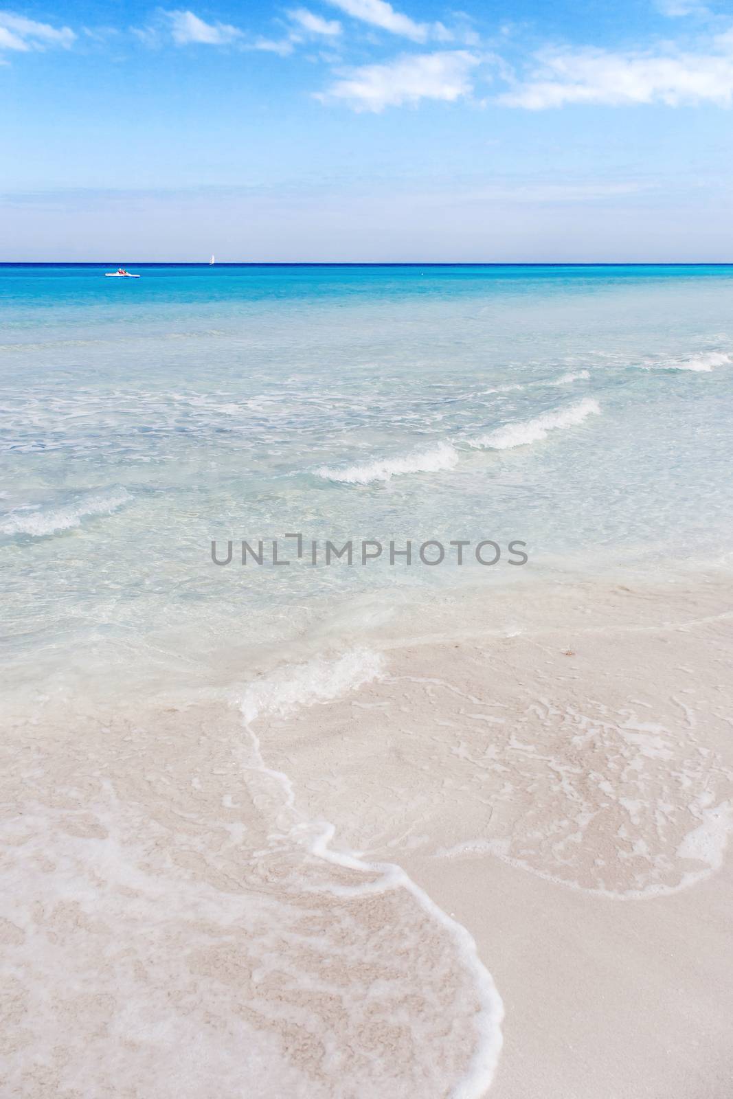 Soft wave of Caribbean sea on sandy Varadero beach. Summer peaceful background. Cuba.