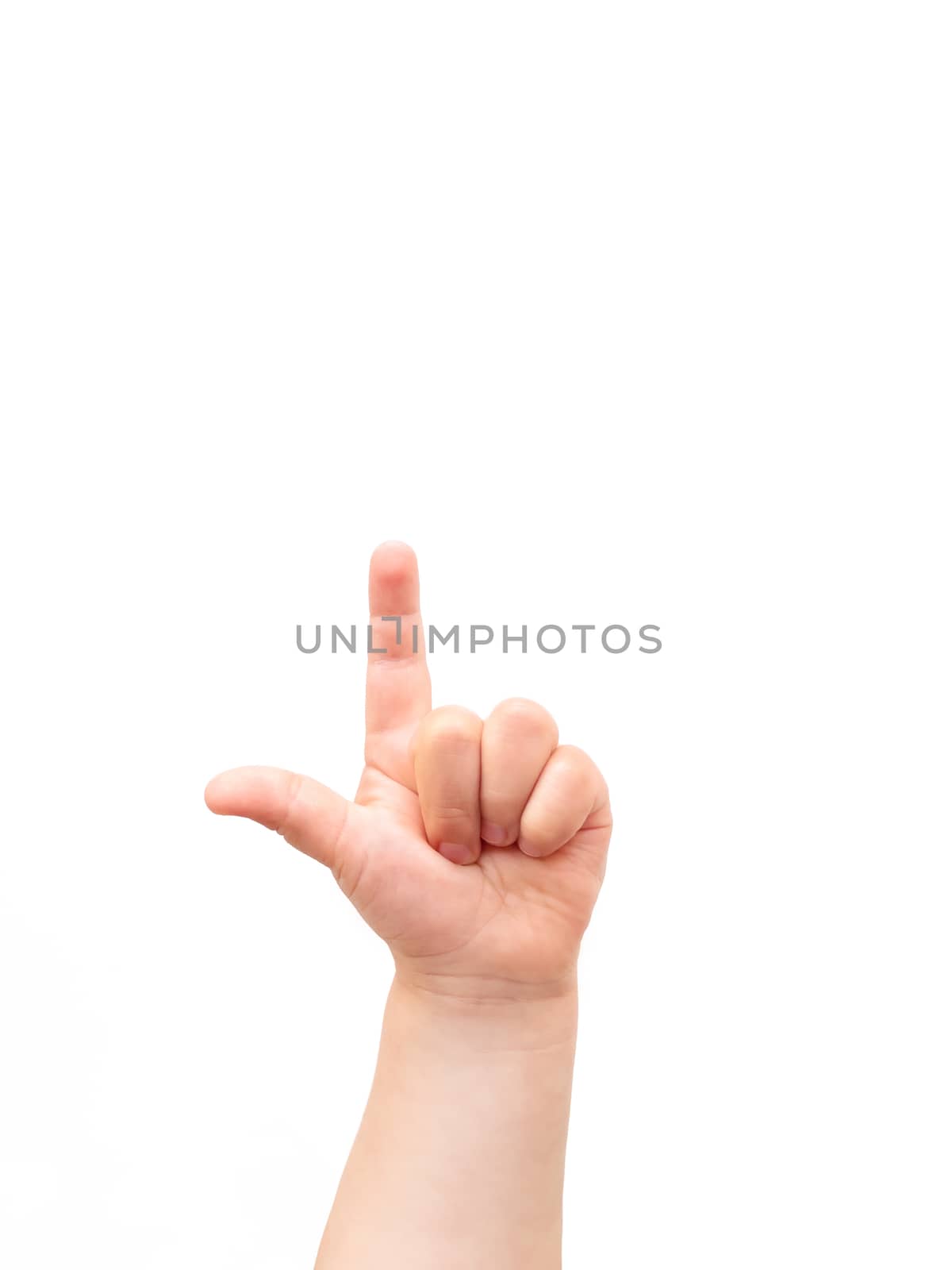 Child's hand on white background. The child points at something with his index finger. Flat lay, top view, copyspace.