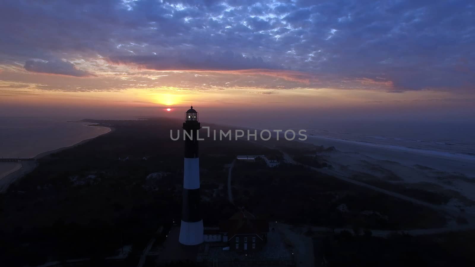 Aerial View of Sunrise at lighthouse on Long Island on a Spring Morning by a Drone