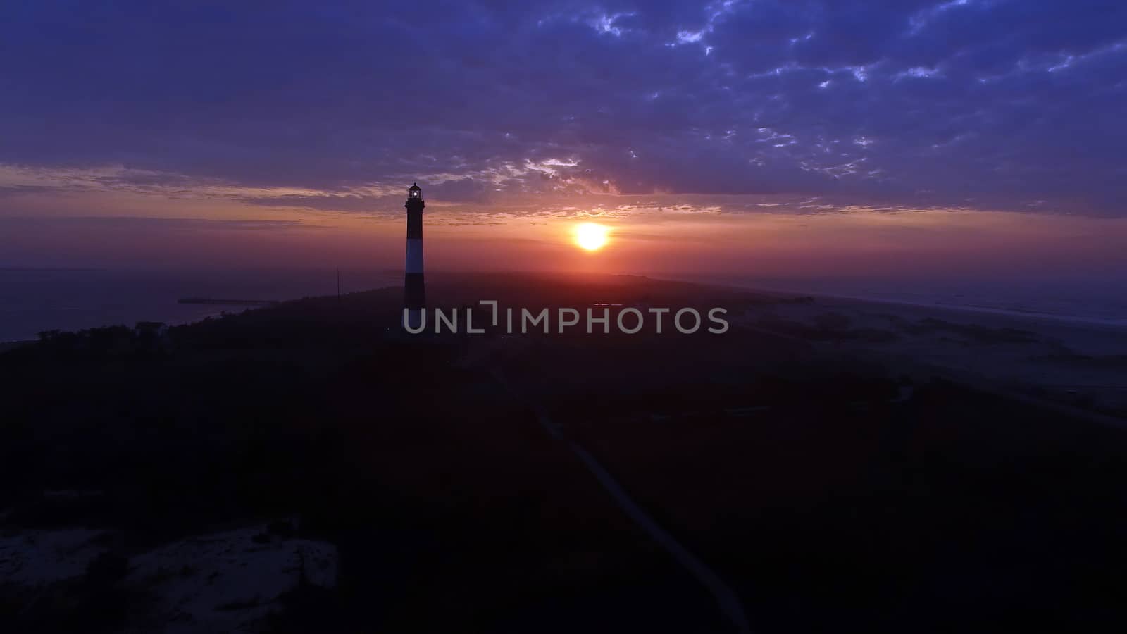 Aerial View of Sunrise at lighthouse on Long Island on a Spring Morning by a Drone